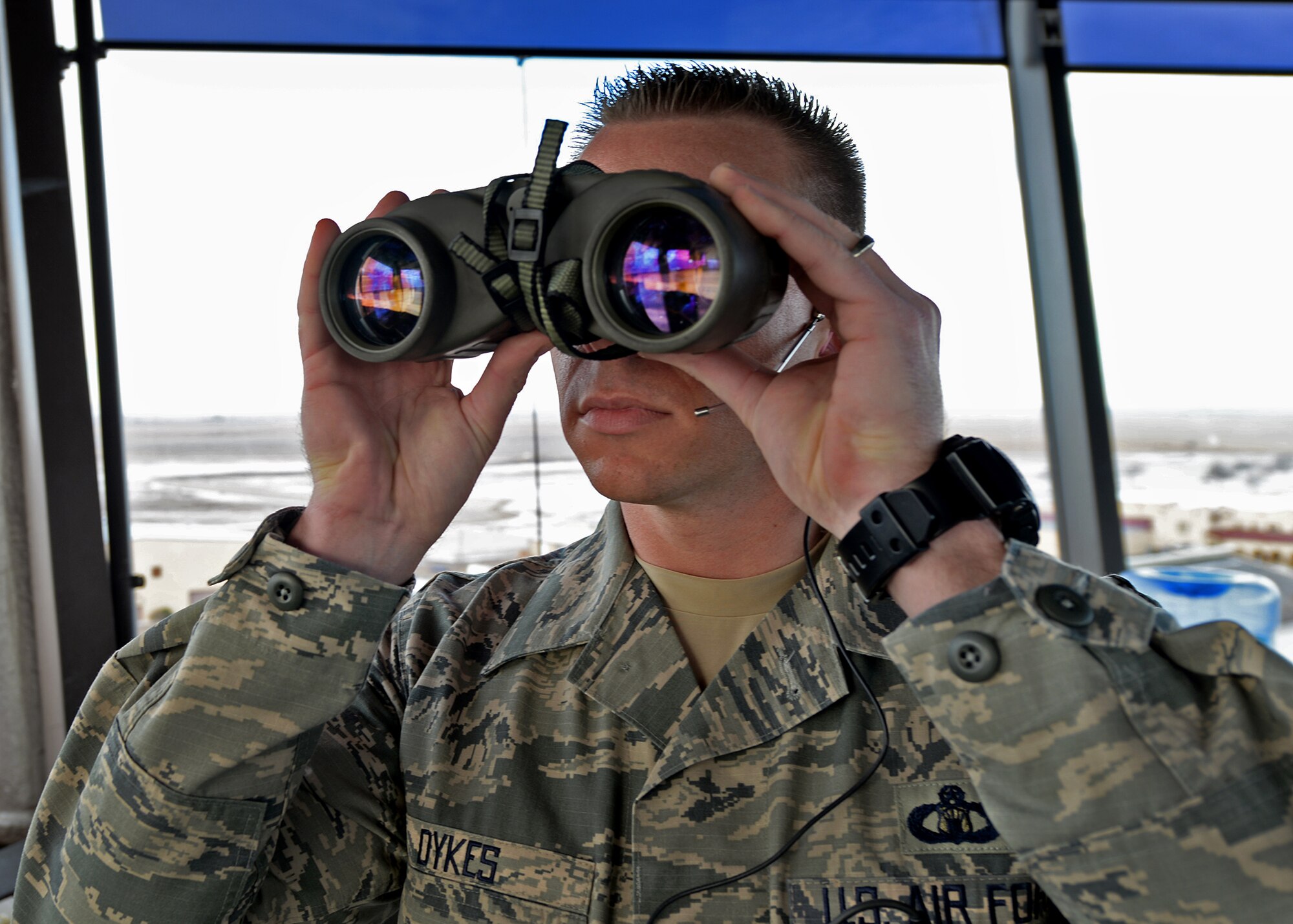 U.S. Air Force Master Sgt. Clint Dykes, 27th Special Operations Support Squadron chief controller, scans the horizon for signs of incoming aerial assets Feb. 24, 2015 at Cannon Air Force Base, N.M. Dykes is dedicated to the training of his Airmen and furthering the success of the members of the 27th SOSS. (U.S. Air Force photo/Airman 1st Class Chip Slack)