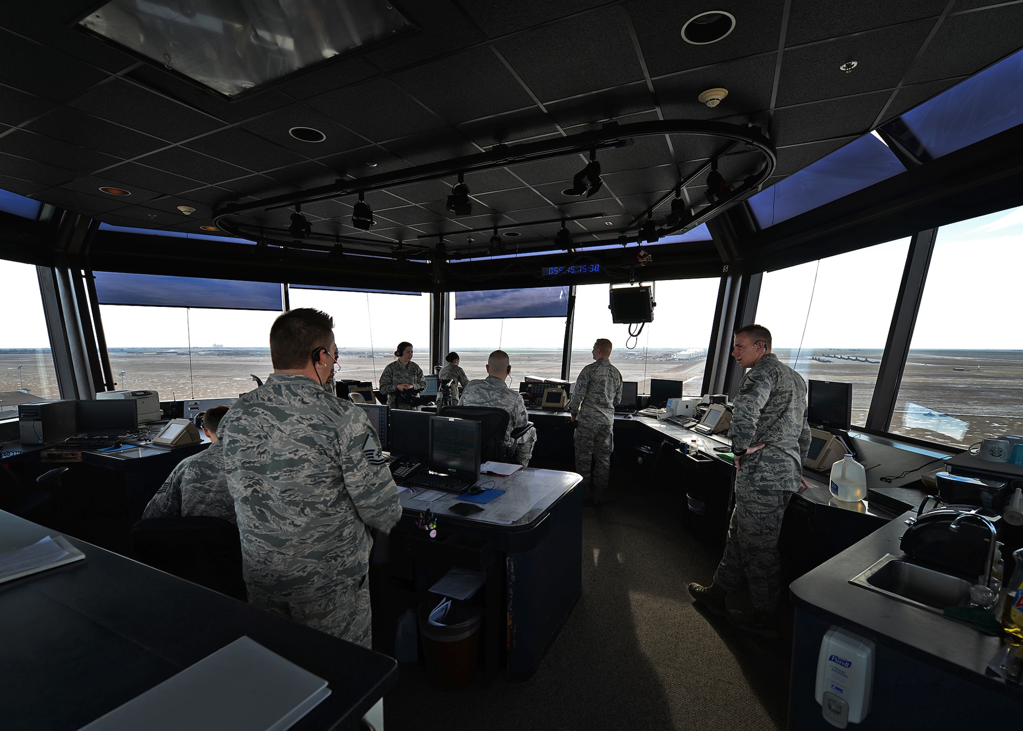 Members of the 27th Special Operations Support Squadron air traffic control man the tower and maintain constant communication with aircraft Feb. 24, 2015 at Cannon Air Force Base, N.M. The men and women of the 27th SOSS ensured that 2014 was the safest year in aviation and are striving to continue that momentum. (U.S. Air Force photo/Airman 1st Class Chip Slack)