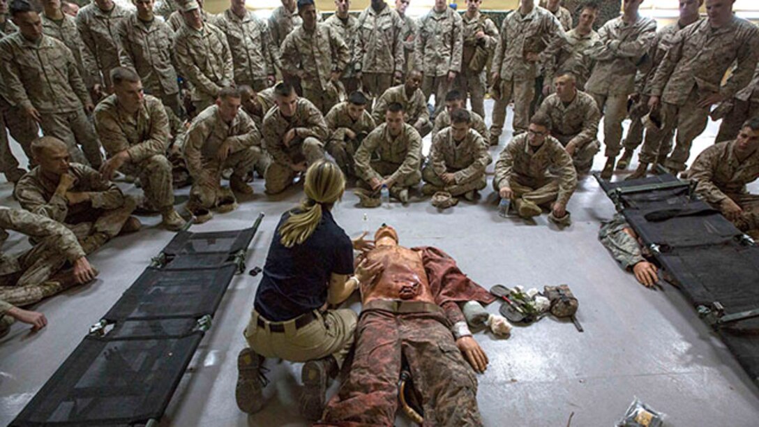 Marines with India Company, Battalion Landing Team 3rd Battalion, 6th Marine Regiment, 24th Marine Expeditionary Unit, receive a demonstration on  casualty aid during combat life saver training at Camp Buehring, Kuwait, Feb. 2, 2015. A contingent of 24th MEU Marines is conducting scheduled sustainment training in Kuwait. The 24th MEU is embarked on the ships of the Iwo Jima Amphibious Ready Group and deployed to maintain regional security in the U.S. 5th Fleet area of operations.