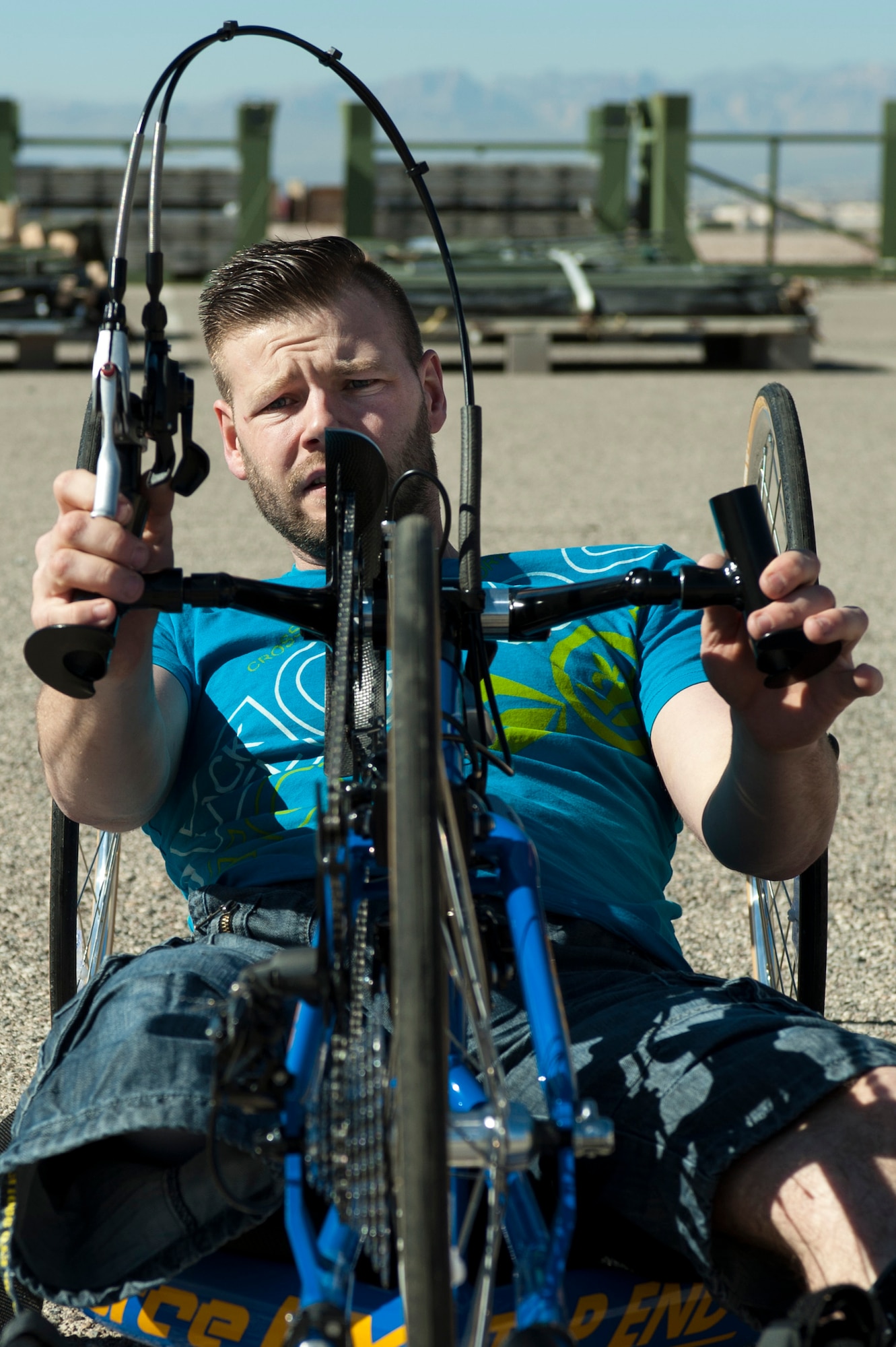 Garith Golightly, adjusts his bike during a cycling fitting session Feb. 26, 2015, at Nellis Air Force Base, Nev. Golighltly is a 2015 Help for Heroes cycling team member. The British Help for Heroes team was invited to the 2015 Air Force Trials as a way to enhance international partnerships. (U.S Air Force photo/Senior Airman Timothy Young)