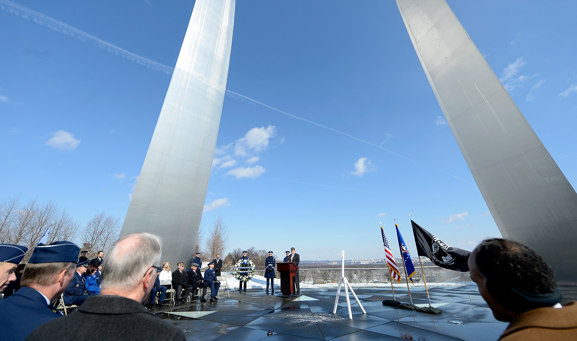 Michael L. Rhodes addresses an audience during a wreath laying ceremony March 2, 2015, which was hosted by Air Force Chief of Staff Gen. Mark A. Welsh III, to honor Air Force Vietnam prisoners of war and missing in action at the Air Force Memorial in Arlington, Va. Rhodes is the director of administration and management for the Office of the Secretary of Defense. (U.S. Air Force photo/Scott M. Ash)