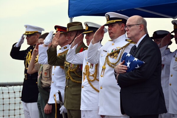 SUNDA STRAIT (Mar. 1, 2015) - Participants in a wreath laying ceremony, held in commemoration of the 73rd anniversary of the Battle of Sunda Strait, salute during the playing of taps aboard the guided-missile destroyer USS Sampson (DDG 102).  Representatives from Australia, the U.S. and Indonesia visited the graves of HMAS Perth (D 29) and USS Houston (CA 30) which were sunk fighting Japanese naval forces March 1, 1942.  More than 1,000 Australian and U.S. Sailors gave their lives during the battle.   150301-N-ZZ999-035