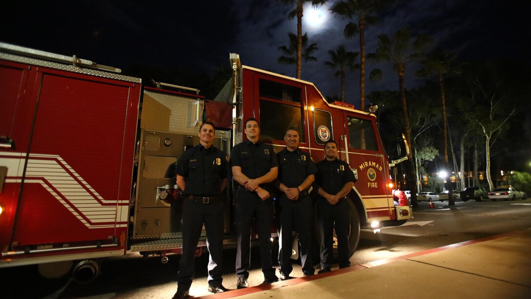 From left to right, Bryan Elder, engineer, Joshua Marque, firefighter, Danny Rivas, captain, Jorge Ramirez, firefighter, all with the Miramar Fire Department, stand in front of their truck after the 2015 Scripps Ranch Civic Association Recognition Night at Scripps Ranch Library in San Diego, March 2. The firefighters were recognized for their outstanding service to the community at the event.