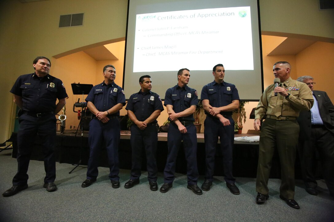 Col. John Farnam, right, Marine Corps Air Station Miramar commanding officer, makes a speech commending the Miramar Fire Department during 2015 Scripps Ranch Civic Association Recognition Night at Scripps Ranch Library in San Diego, March 2. Firefighters with the Miramar Fire Department were recognized for their outstanding service to the community at the event.