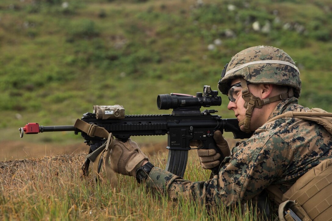U.S. Marine Lance Cpl. Dmitriy Nikolayenko provides security during a mechanized raid as part of Amphibious Squadron/Marine Expeditionary Unit Integration Training (PMINT) aboard San Clemente Island, Calif., March 1, 2015. Nikolayenko is a rifleman with Kilo Company, Battalion Landing Team 3rd Battalion, 1st Marine Regiment, 15th Marine Expeditionary Unit. During the training, Marines learned to integrate with supporting elements such as military law enforcement, explosive ordnance disposal technicians, and intelligence analysts. (U.S. Marine Corps photo by Sgt. Emmanuel Ramos/Released)