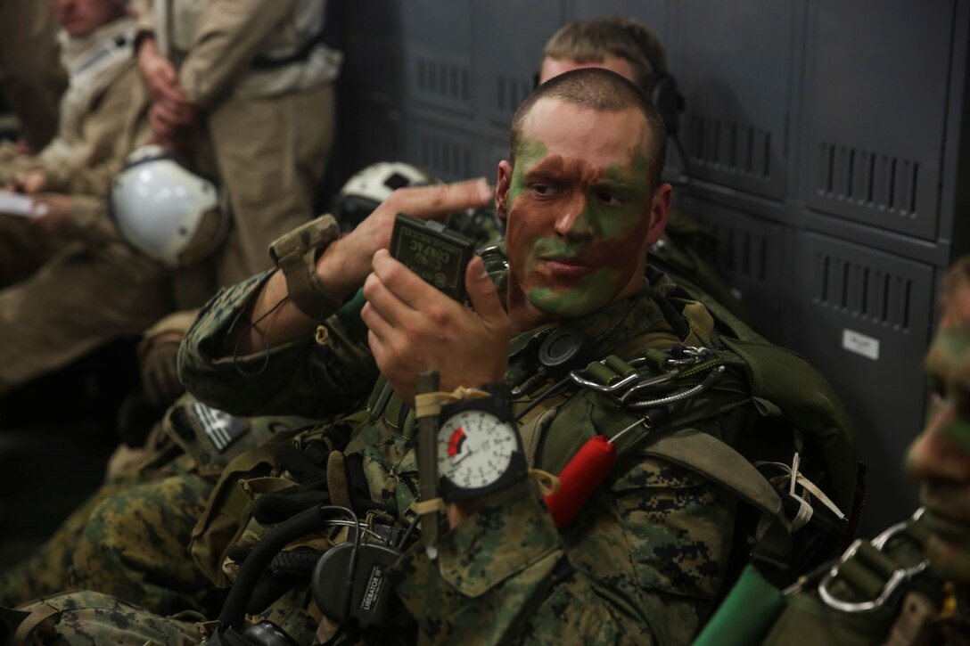 U.S. Marine Sgt. Andy Muller prepares for a reconnaissance and surveillance mission Amphibious Squadron/Marine Expeditionary Unit Integration Training (PMINT) off the coast of San Diego March 1, 2015. Muller is with the 15th Marine Expeditionary Unit’s Maritime Raid Force. MRF Marines took off from the USS Essex (LHD-2) and parachuted from an Osprey in order to set up an observation point prior to a follow-on mission. (U.S. Marine Corps Photo by Cpl. Anna Albrecht/Released)