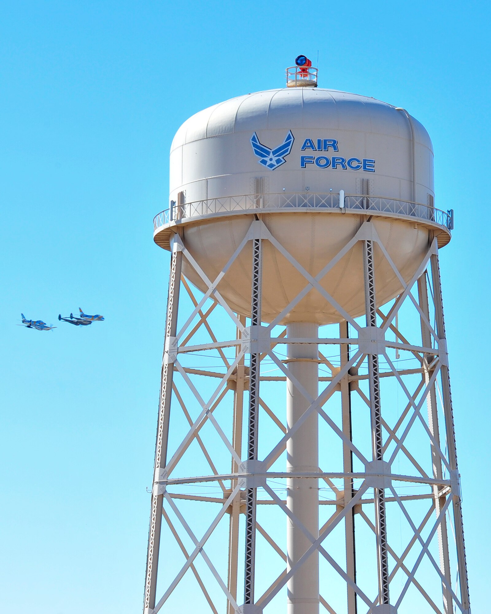 A P-38 Lightning, P-51 Mustang and two F-86 Sabres fly in formation during the 2015 Heritage Flight Training and Certification Course at Davis-Monthan Air Force Base, Ariz., Feb. 27, 2015.  The annual aerial demonstration training event has been held at D-M since 2001, providing civilian and military pilots the opportunity to practice flying in formation for the upcoming air show season. (U.S. Air Force photo by Airman 1st Class Chris Massey/Released)