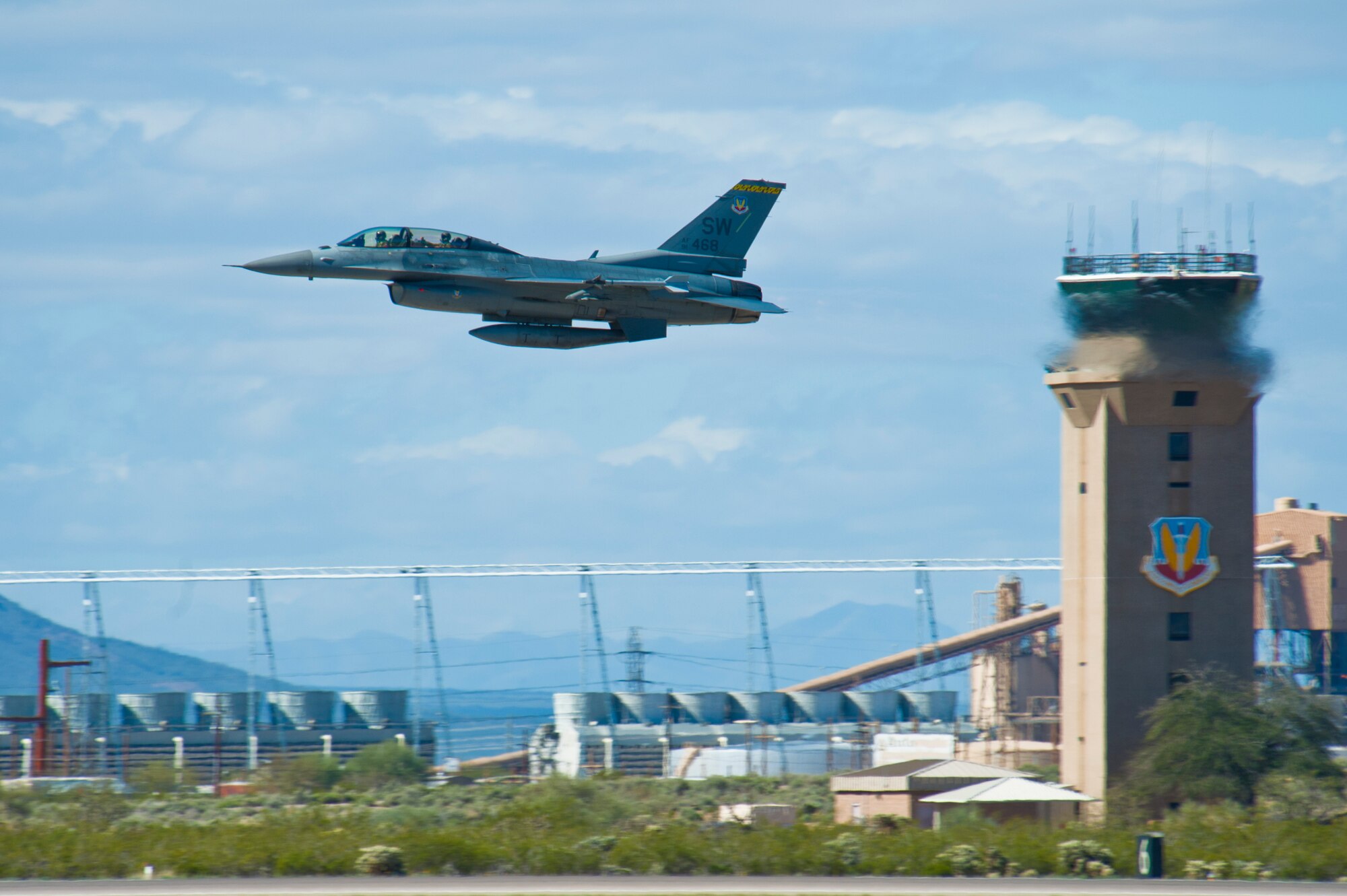 An F-16 Fighting Falcon takes off during the 2015 Heritage Flight Training and Certification Course at Davis-Monthan Air Force Base, Ariz., March 1, 2015.  The annual aerial demonstration training event has been held at D-M since 2001, providing civilian and military pilots the opportunity to practice flying in formation for the upcoming air show season. (U.S. Air Force photo by Airman 1st Class Chris Massey/Released)