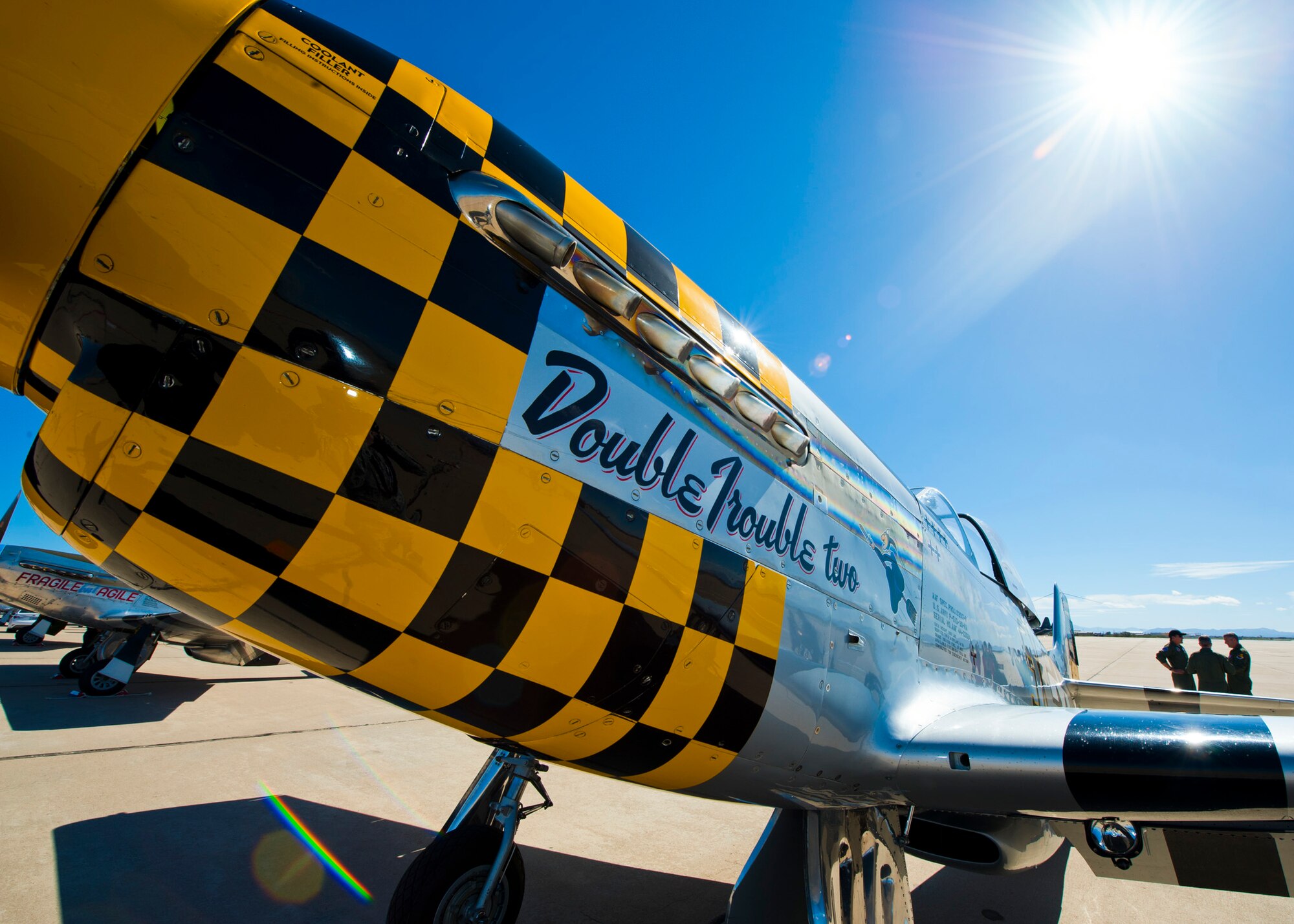 A P-51 Mustang sits on the flightline during the 2015 Heritage Flight Training and Certification Course at Davis-Monthan Air Force Base, Ariz., March 1, 2015.  Established in 1997, the HFTCC featured aerial demonstrations from historical and modern fighter aircraft which will fly in formation together during air shows across the country. (U.S. Air Force photo by Airman 1st Class Chris Massey/Released)