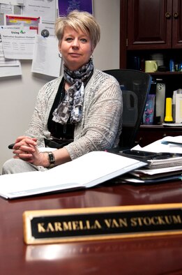 Karmella Van Stockum, 90th Force Support Squadron Education and Training chief in the Education and Training Center on F.E. Warren Air Force Base, Wyo., poses for a portrait in her office Feb. 25, 2015. The Center's mission is to provide the necessary education and training to sustain nuclear surety and personal development for the Warren community. (U.S. Air Force photo by Airman 1st Class Malcolm Mayfield)