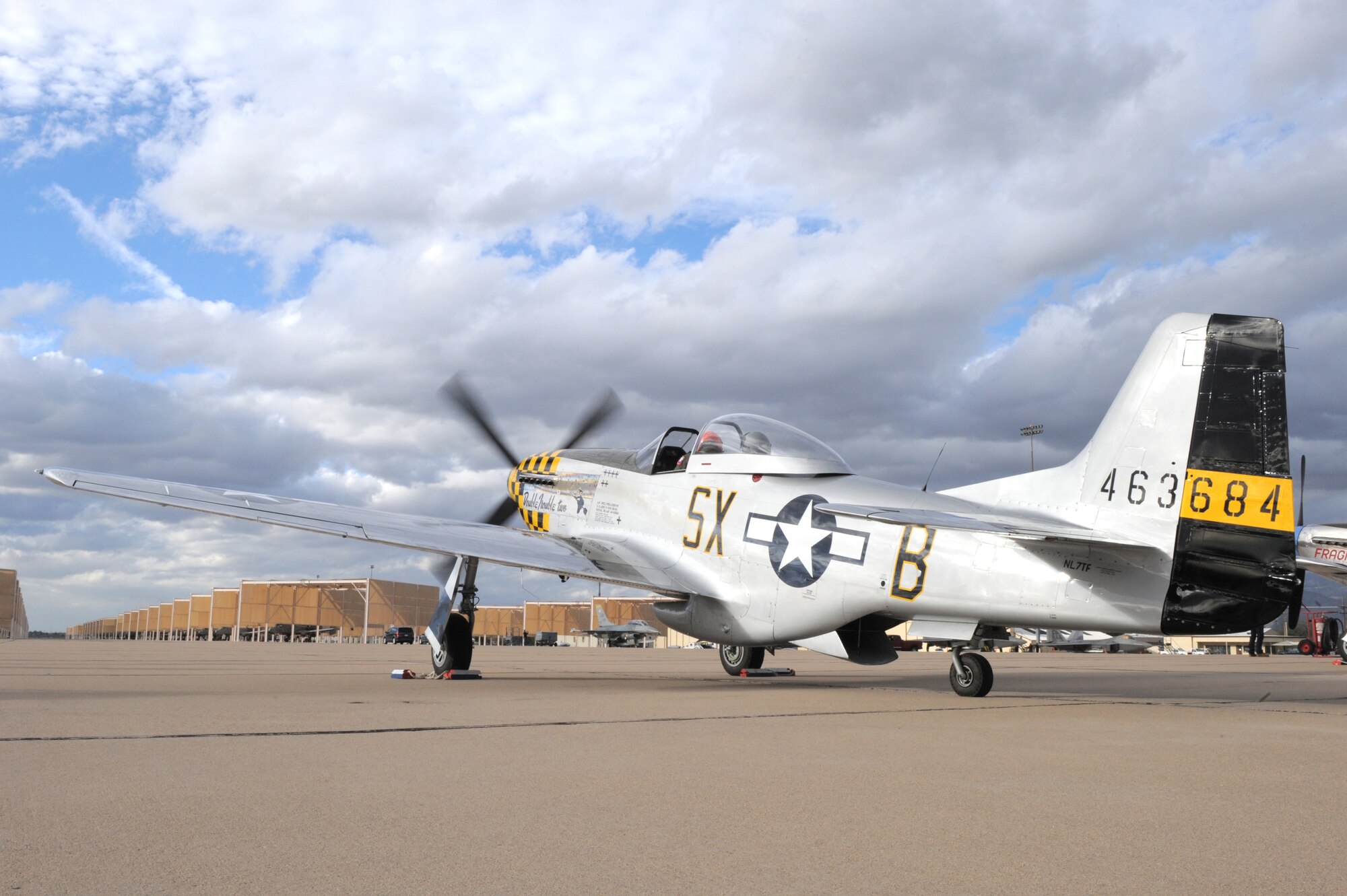 Vlado Lenoch, civilian pilot, and Col. Stephen Renner, 355th Fighter Wing vice commander, prepare to fly in a P-51 Mustang during the 2015 Heritage Flight Training and Certification Course at Davis-Monthan Air Force Base, Ariz., Feb. 28, 2015. During the course, aircrews practiced ground and flight training to enable civilian pilots of historic military aircraft and U.S. Air Force pilots of current fighter aircraft to fly safely in formations together. (U.S. Air Force photo by Airman 1st Class Chris Drzazgowski/Released)