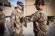 Sgt. Clay Beyersdorfer of the 70th Mobile Public Affairs Detachment took home top honors with the Paul D. Savanuck Military Print Journalist of the Year award in the 2014 Army National Guard Media Contest. In this photo, Maj. Frank Analla promotes Beyersdorfer to the rank of sergeant during their deployment to Kandahar, Afghanistan in April 2014. (U.S. Army photo by Sgt. First Class Rob Oson) 