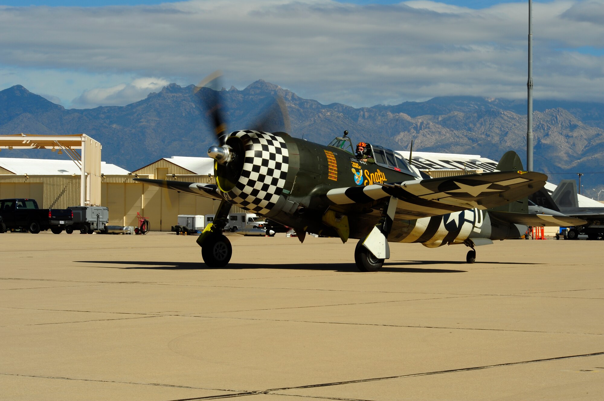 A P-47 Thunderbolt taxis to the runway during the 2015 Heritage Flight Training and Certification Course at Davis-Monthan Air Force Base, Ariz., March 1, 2015. The aircraft that participated in this year’s course were the historic P-51 Mustang, P-40 Warhawk, P-38 Lightning, P-47 Thunderbolt, F-86 Sabre, along with the current F-22 Raptor and the F-16 Fighting Falcon. (U.S. Air Force photo by Tech. Sgt. Courtney Richardson/Released)