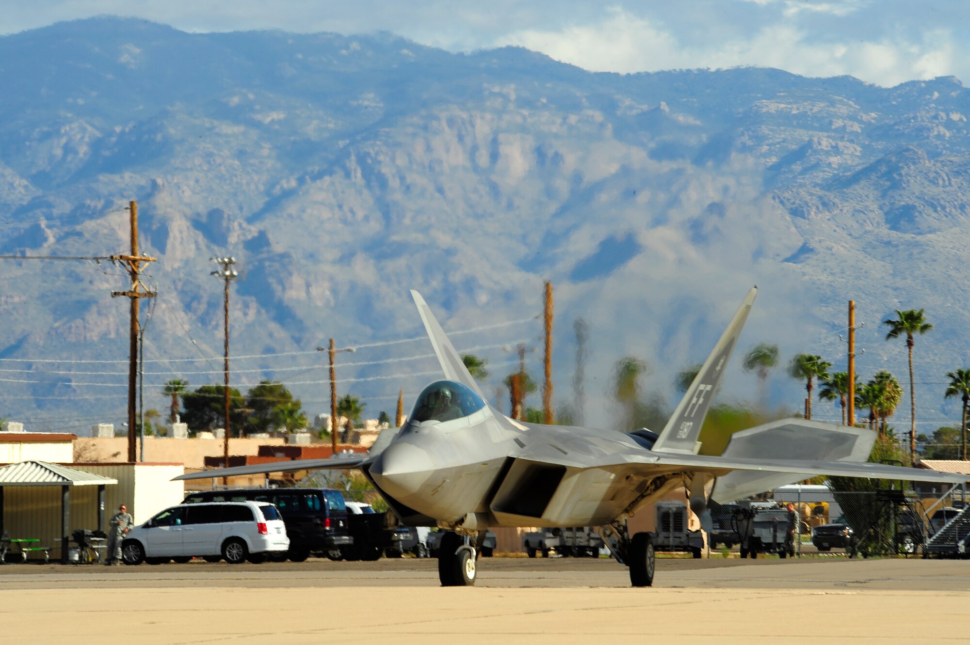 A F-22 Raptor taxis to the runway during the 2015 Heritage Flight Training and Certification Course at Davis-Monthan Air Force Base, Ariz., March 1, 2015. During the course, aircrews practiced ground and flight training to enable civilian pilots of historic military aircraft and U.S. Air Force pilots of current fighter aircraft to fly safely in formations together. (U.S. Air Force photo by Tech. Sgt. Courtney Richardson/Released)

