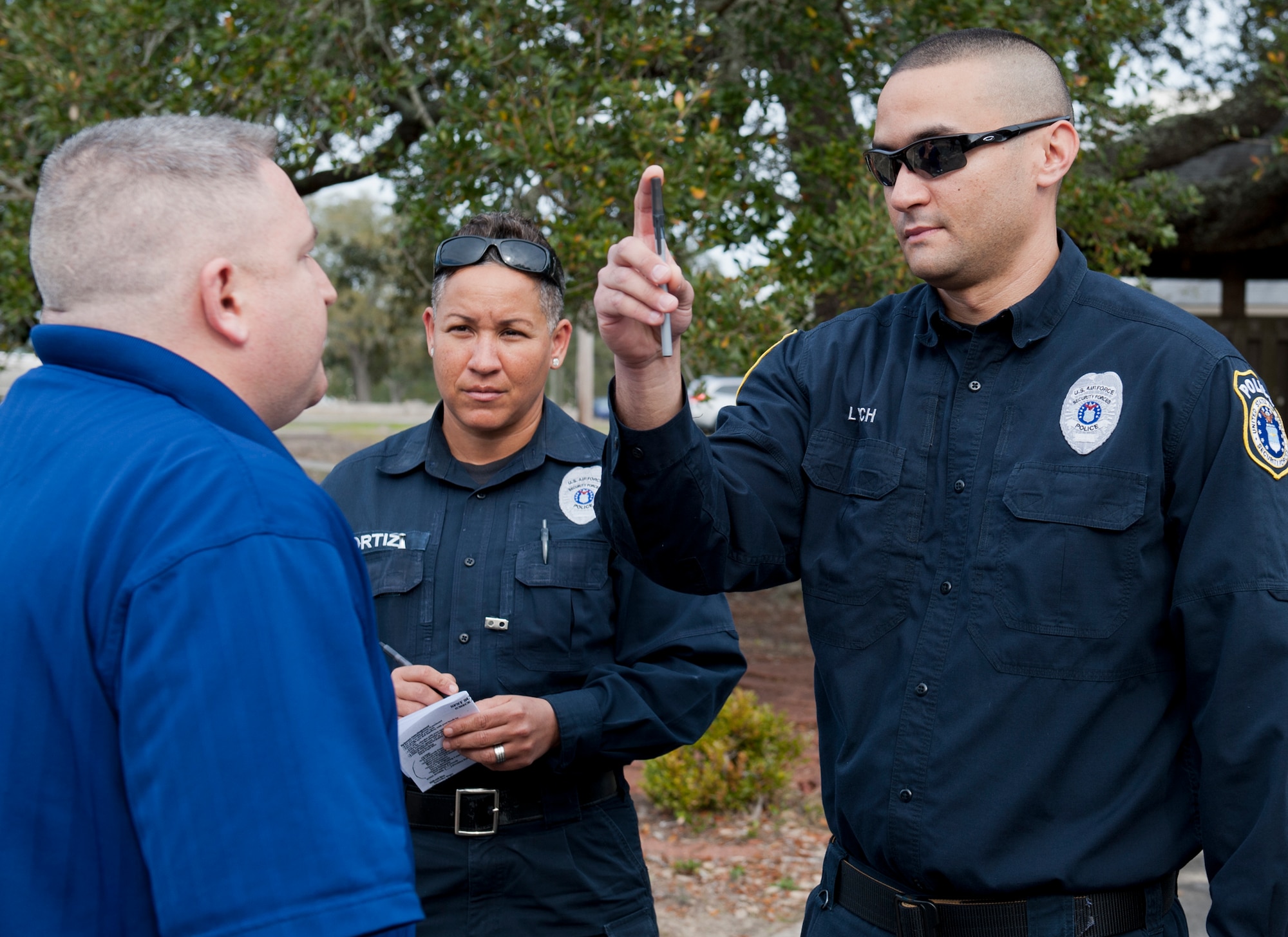 Officers Joseph Lynch and Maria Ortiz judge the intoxication level of an inebriated volunteer during a 96th Security Forces training session here Feb. 27. A horizontal gaze nystagmus test evaluates involuntary jerking of the eye while “walk and turn” and standing on one leg exercises evaluates coordination. This is the first time the class was hosted on base by Escambia County law enforcement to help Eglin Defenders test the skills, compare their judgment to breathalyzer scores and learn new techniques.  (U.S. Air Force photo/Chrissy Cuttita)