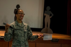 Tech. Sgt. Latoya Johnson-Mallory engages the audience during a 628th Wing Staff Agencies Sexual Assault Prevention event Feb. 26, 2015, at Joint Base Charleston, S.C. The event was held as an open discussion about the differences between restricted and unrestricted reporting of sexual assault cases. During the event a video of the Chief of Staff of the Air Force, Gen. Mark A. Welsh III and Chief Master Sgt. of the Air Force James A. Cody, discussed the importance of Airmen’s roles as mandatory reporters of a sexual assault. Johnson-Mallory is a 628th ABW legal office paralegal. (U.S. Air Force photo/Senior Airman Jared Trimarchi) 