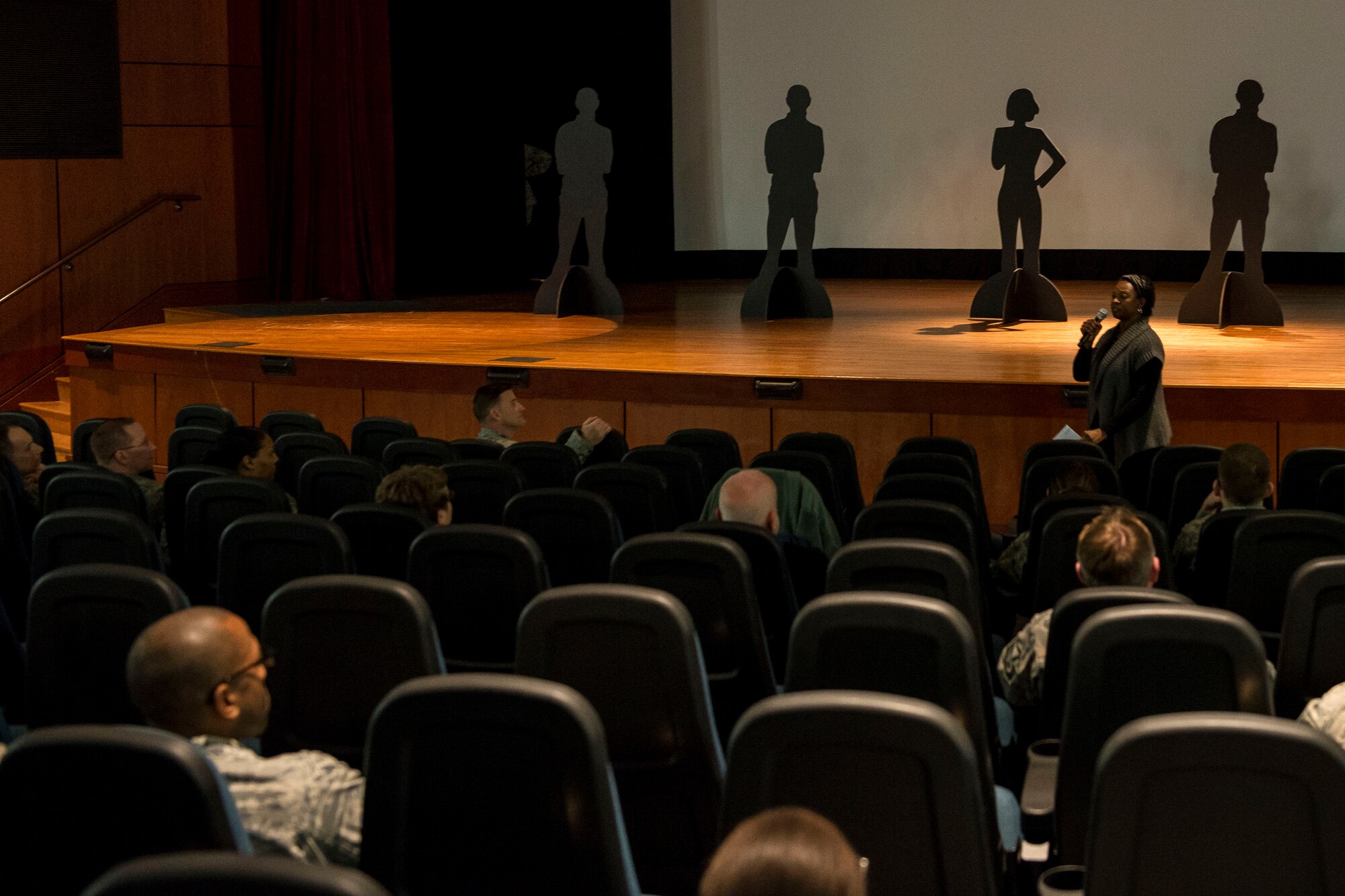 Sexual Assault Victim Advocate, Shelia Bacon addresses the crowd of Airmen and civilians during a 628th Wing Staff Agencies Sexual Assault Prevention event Feb. 26, 2015, at Joint Base Charleston, S.C. The event was held as an open discussion about the differences between restricted and unrestricted reporting of sexual assault cases. During the event a video of the Chief of Staff of the Air Force, Gen. Mark A. Welsh III and Chief Master Sgt. of the Air Force James A. Cody, discussed the importance of Airmen’s roles as mandatory reporters of a sexual assault. Bacon is the JB Charleston SAPR Victim Advocate specialist. (U.S. Air Force photo/Senior Airman Jared Trimarchi) 

