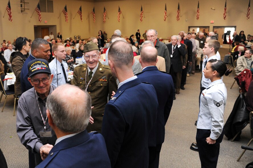 Base leaders greet World War II veterans during the WWII luncheon on Barksdale Air Force Base, La., Feb. 27, 2015. More than 140 veterans from the local area attended the annual event. (U.S. Air Force photo/ Senior Airman Jannelle Dickey)