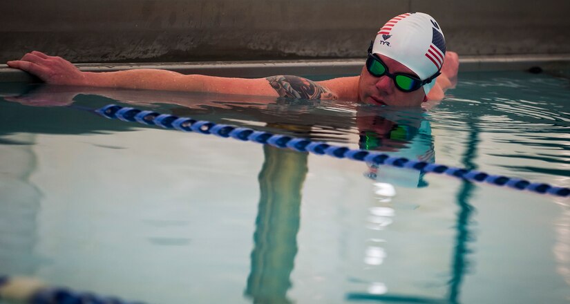 Lt. Shannon Scaff awaits the go signal before a 24-hour swim Feb. 27, 2015 at the Martin Luther King Jr. Pool in Charleston, S.C. He swam to honor a fallen pilot and raise money for a non-profit organization. Scaff swam nearly 28 miles in honor of his friend, Coast Guard Lt. Commander Dale Taylor, who lost his life in a helicopter crash with three other Coast Guardsmen Feb. 28, 2012. Scaff is a U.S. Coast Guard’s Maritime Law Enforcement Academy Public Affairs officer and a former helicopter rescue swimmer stationed in Charleston. (U.S. Air Force photo/Senior Airman Jared Trimarchi) 