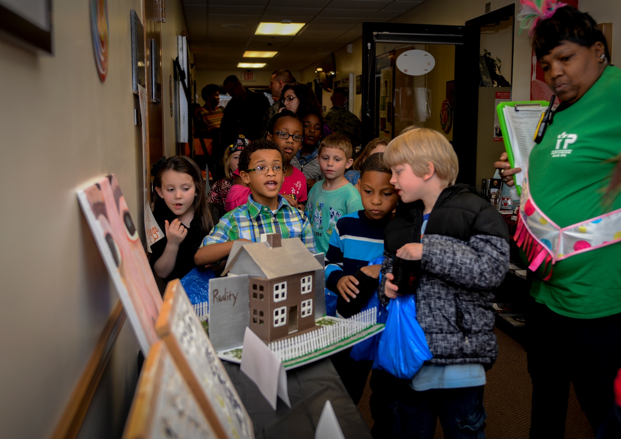 Moody Youth Programs children view displays with information about world literature during the Literacy Fair Feb. 26, 2015, at Moody Air force Base, Ga. The displays featured books including “The Iliad”, “The Odyssey”, “Madame Bovary” and “Beowulf”. (U.S. Air Force photo by Senior Airman Sandra Marrero/Released)
