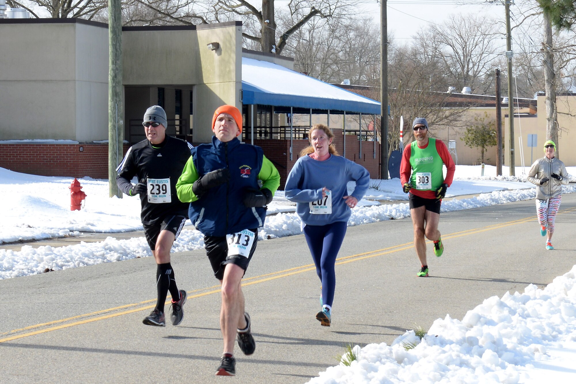 Runners sprint the final stretch of the 17th Annual 10K race at Fort Eustis, Va., Feb. 28, 2015. Approximately 125 runners participated in the race. (U.S. Air Force photo by Staff Sgt. Teresa J. Cleveland/Released)