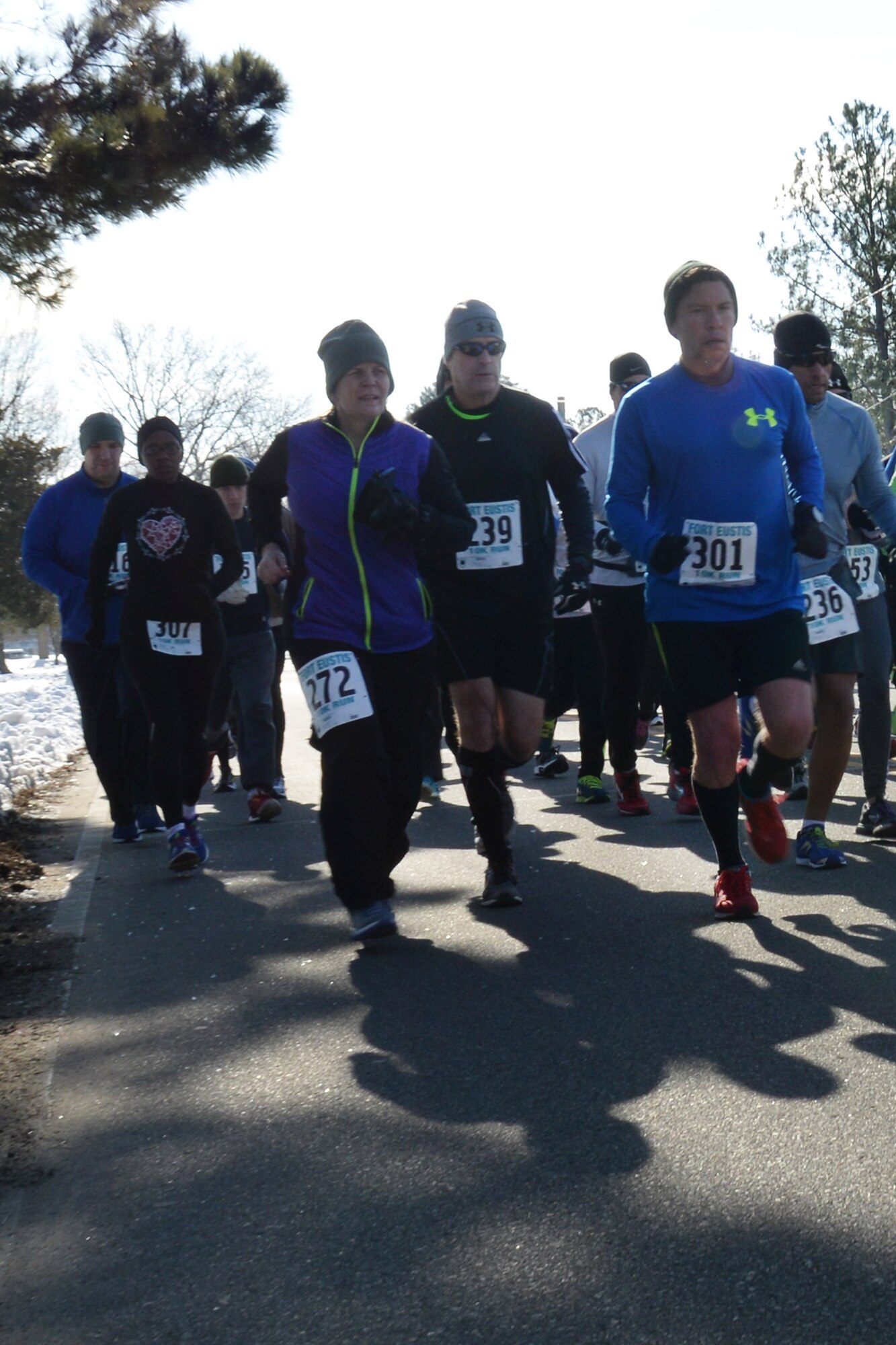 Runners cross the starting line during the 17th Annual Fort Eustis 10K run at Fort Eustis, Va., Feb. 28, 2015. The race was open to the public as part of the Peninsula Track Club. (U.S. Air Force photo by Staff Sgt. Teresa J. Cleveland/Released)