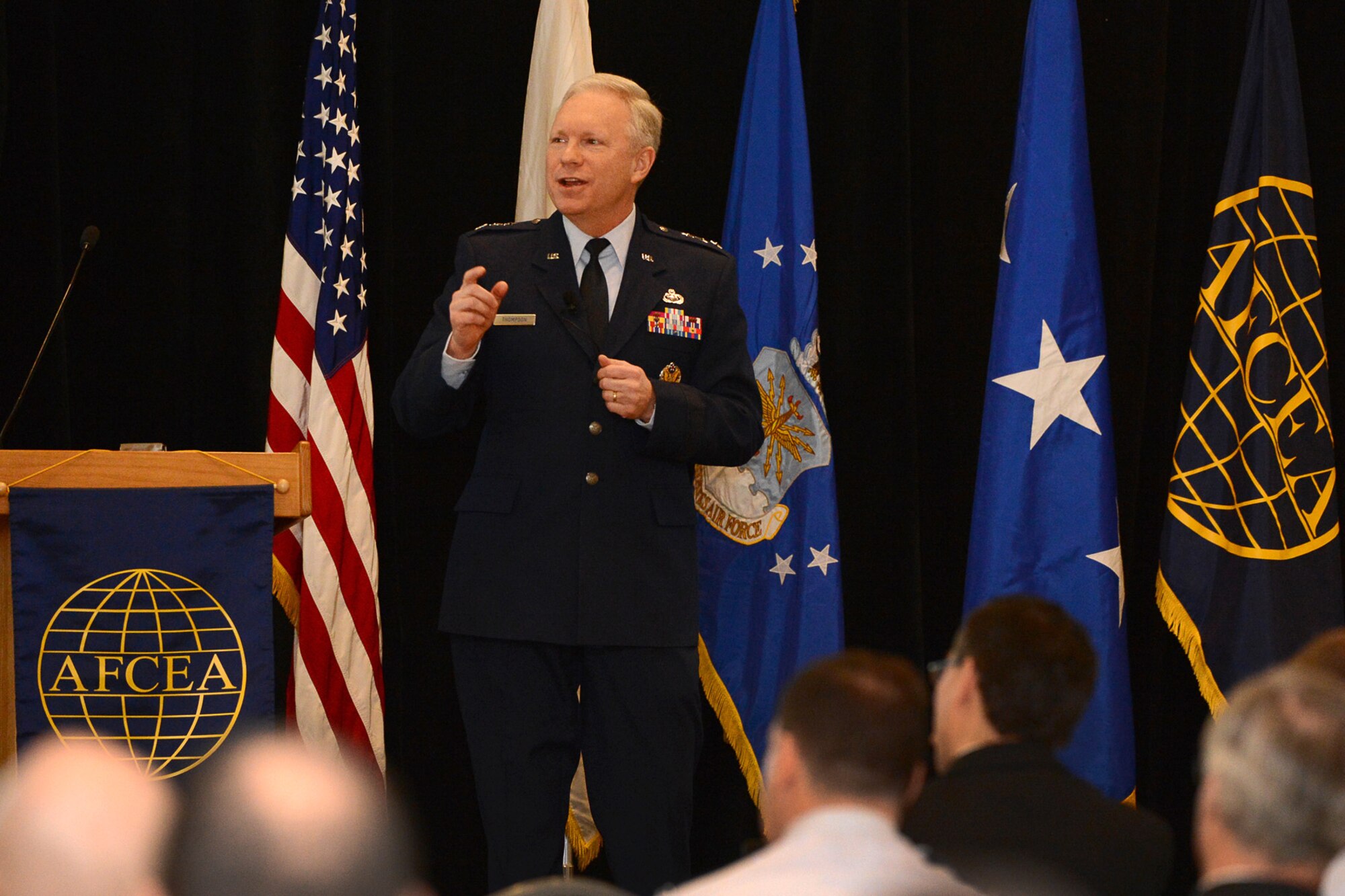 Lt. Gen. John Thompson, Air Force Life Cycle Management Center commander, speaks to attendees at the New Horizons Symposium in Newton, Mass., March 3. Thompson said the center handles more than 3,000 total projects and that they all have certain overlapping needs, including cyber competency. The symposium connects government and industry with a primary focus on upcoming program opportunities. (U.S. Air Force photo by Jerry Saslav)