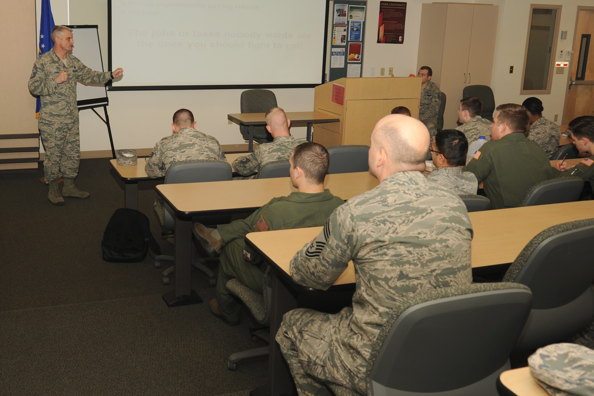 Chief Master Sgt. Christian Pugh, 92nd Air Refueling Wing command chief, talks with Airmen about his five keys to leadership at the education center at Fairchild Air Force Base, Wash., Feb. 18, 2015. The keys he discussed were learn everything, step outside your comfort zone, insert yourself in all situations, challenge processes and take advantage of risks. (U.S. Air Force photo/ Staff Sgt. Samantha Krolikowski)