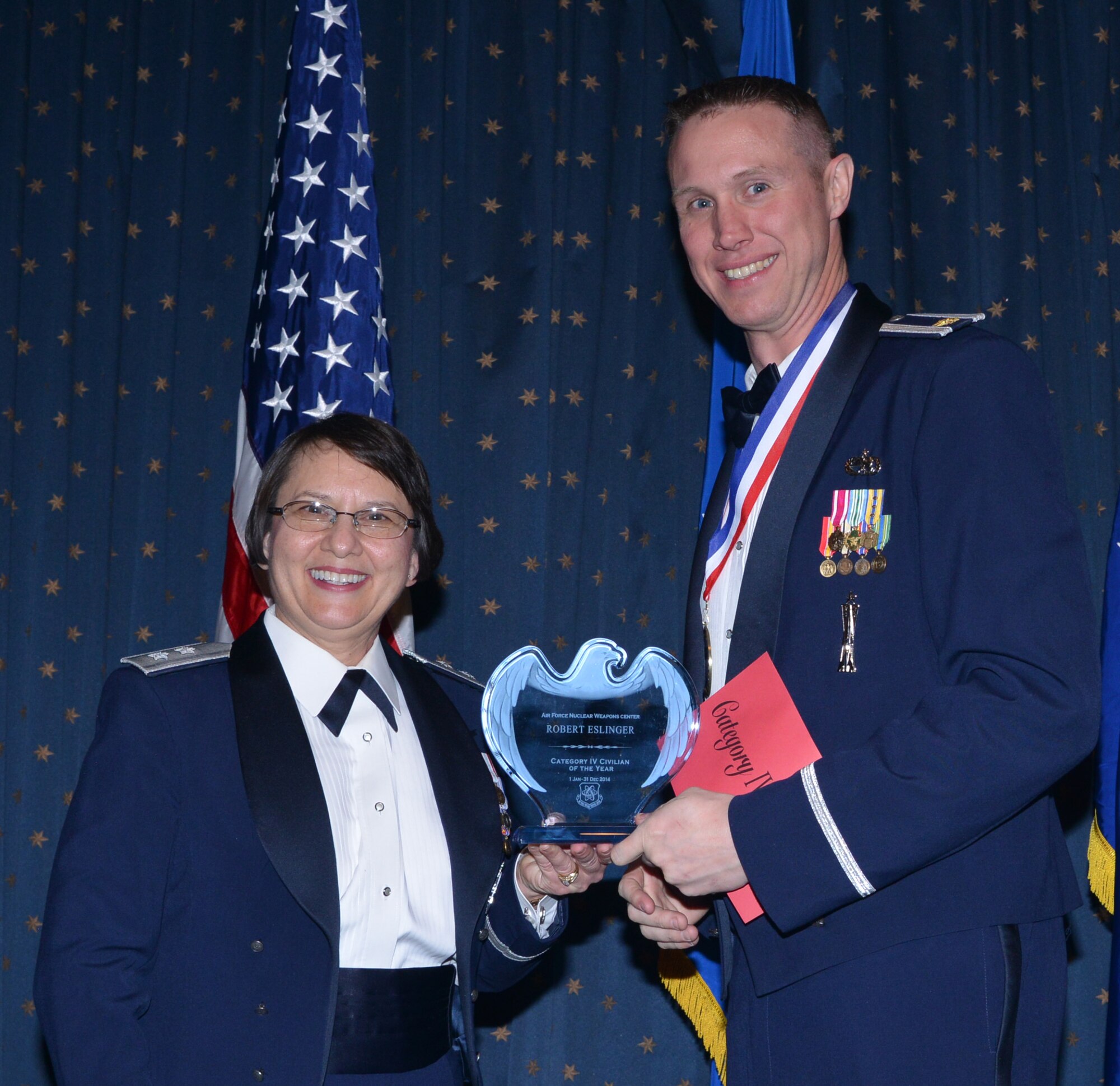 Robert Eslinger, 377th Maintenance Group, was named AFNWC Civilian (Category IV) of the Year at an awards ceremony Feb. 27 at the Mountain View Club. Gen. Sandra Finan, Air Force Nuclear Weapons Center commander, presented the award. (Photo by Todd Berenger)