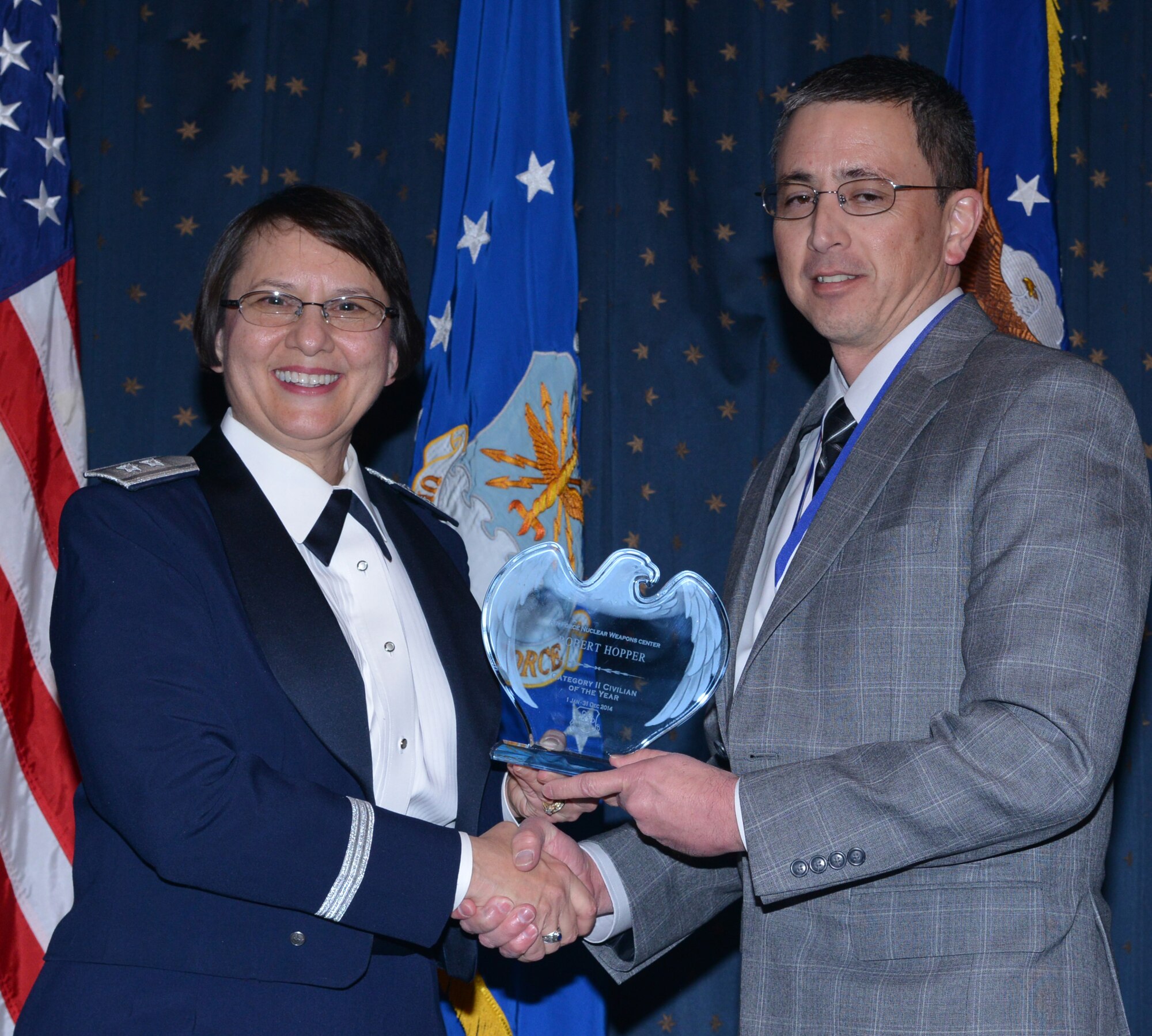 Robert Hopper, ICBM Systems, was named AFNWC Civilian (Category II) of the Year at an awards ceremony Feb. 27 at the Mountain View Club. Gen. Sandra Finan, Air Force Nuclear Weapons Center commander, presented the award. (Photo by Todd Berenger)