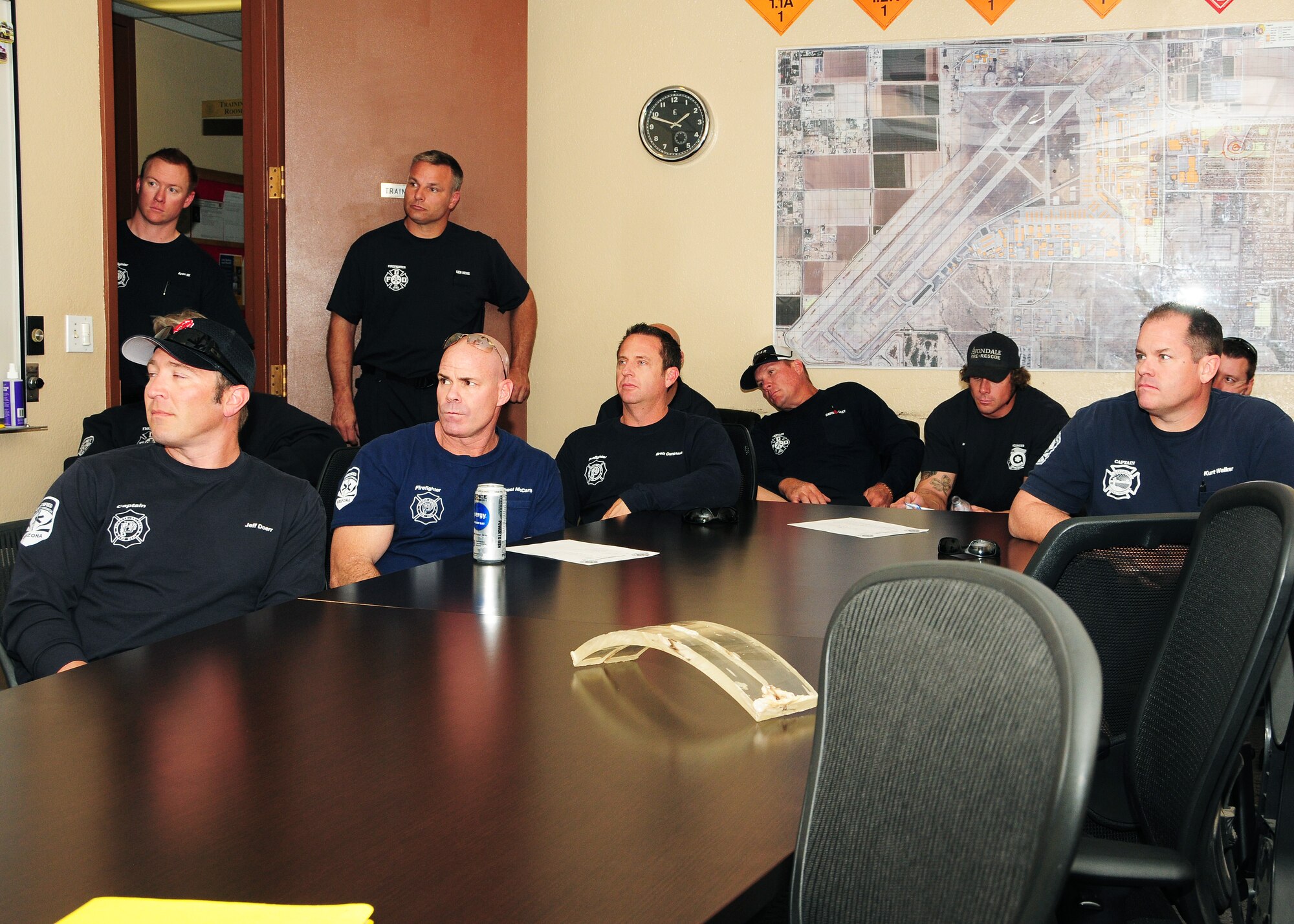 Members from local fire departments watch and listen Feb. 26 during a power point presentation at the  fire station conference room, Luke Air Force Base, Ariz. (U.S. Air Force photo taken by Tech. Sgt. Louis Vega Jr.)