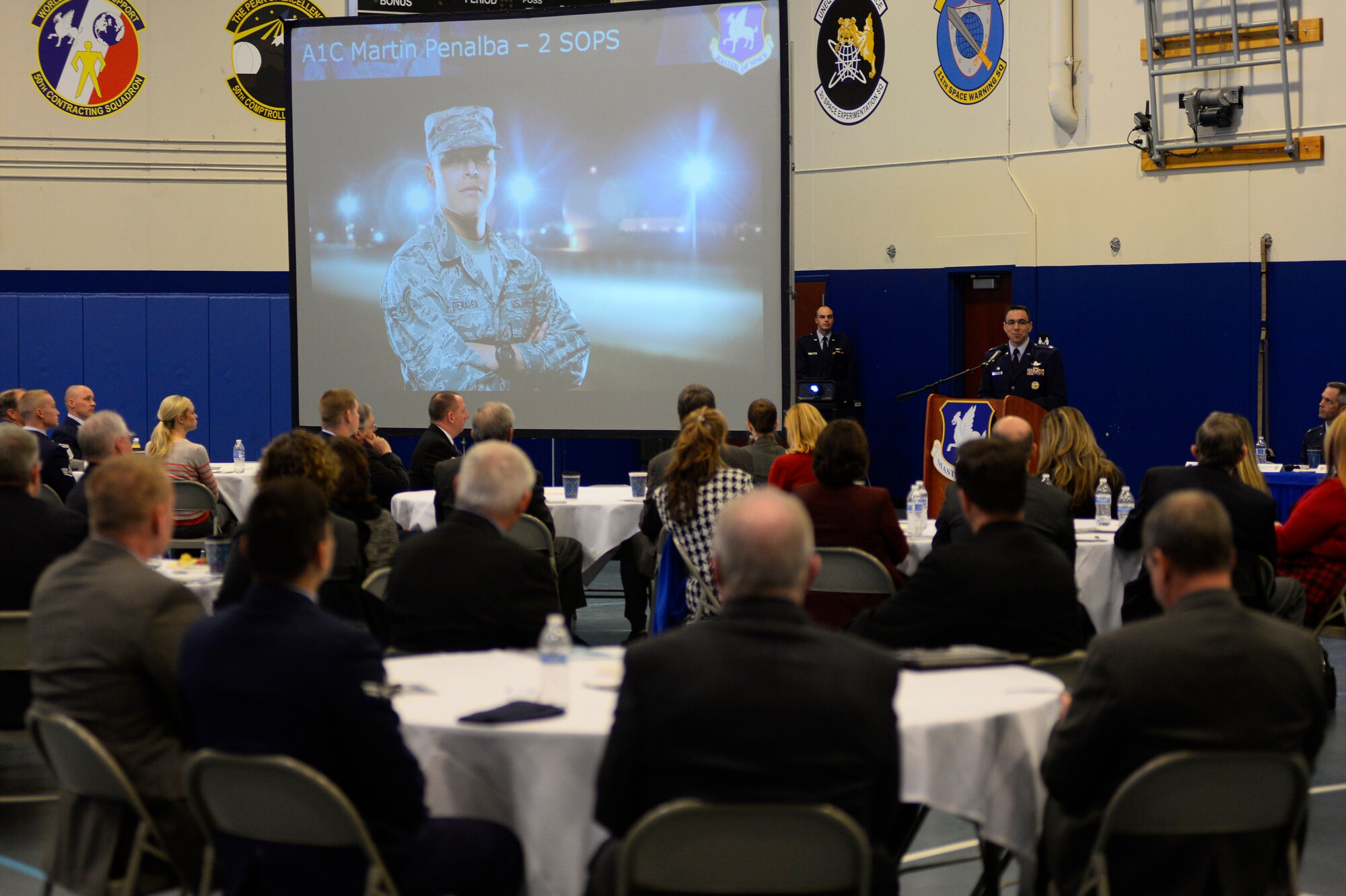 Col. Bill Liquori, 50th Space Wing commander, gives Schriever Air Force Base’s first State of the Base address Feb. 25, 2015 at the Schriever Fitness Center. More than 35 civic leaders, Air Force retirees and representatives from Colorado Springs, Colo. were in attendance for the event. (U.S. Air Force photo/Christopher DeWitt)