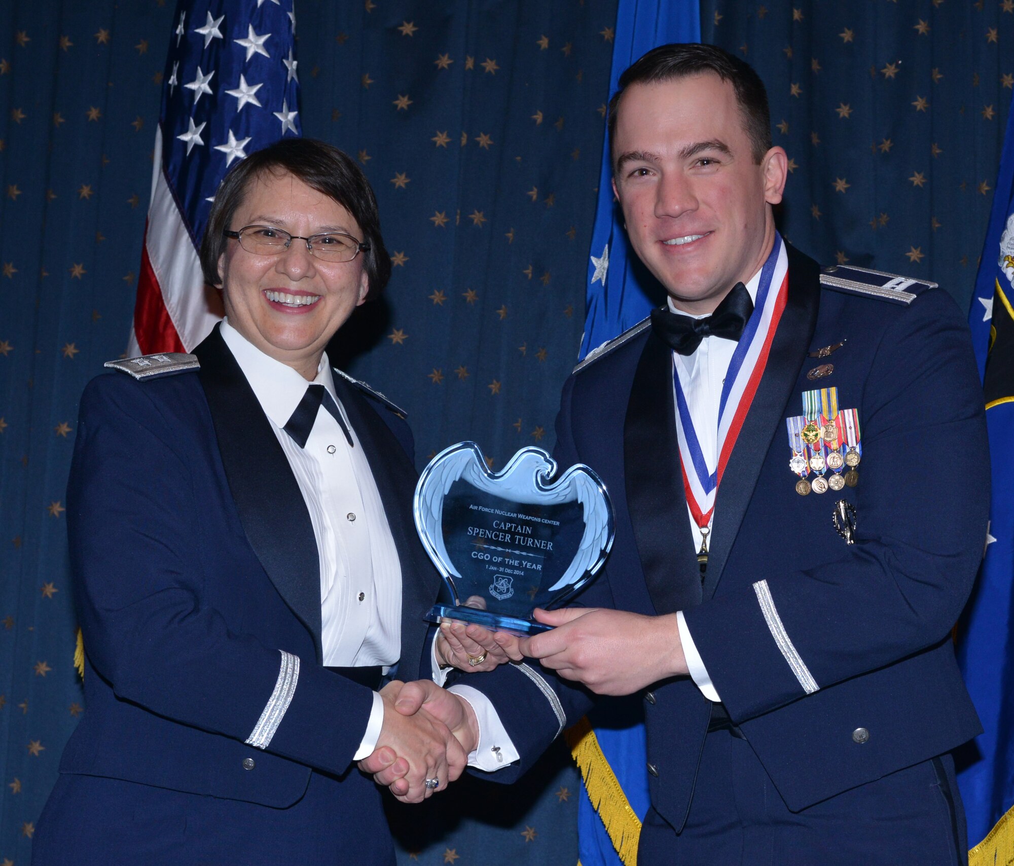 Capt. Spencer Turner, ICBM Systems, was named AFNWC CGO of the Year at an awards ceremony Feb. 27 at the Mountain View Club. Gen. Sandra Finan, Air Force Nuclear Weapons Center commander, presented the award. (Photo by Todd Berenger)