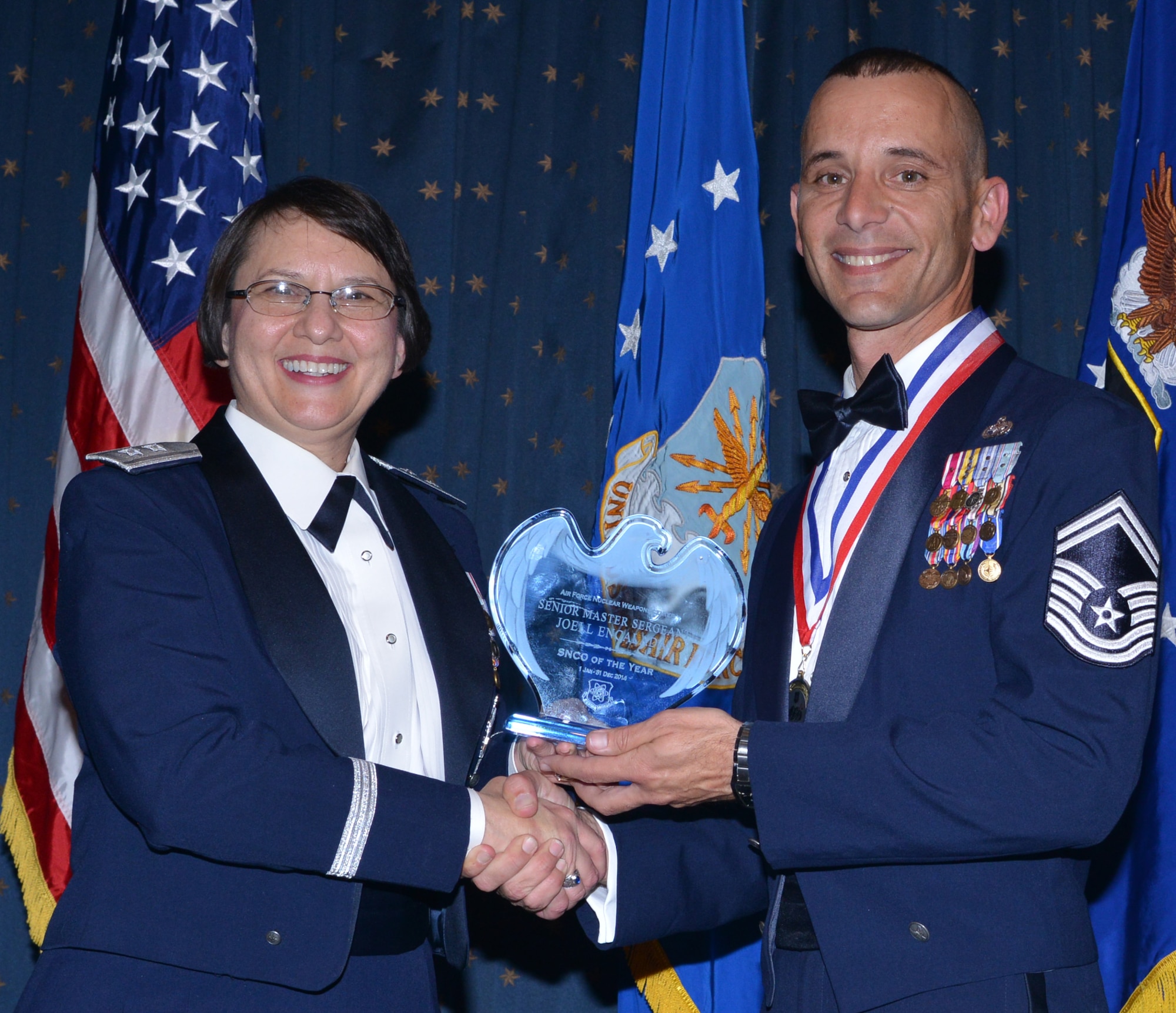 Senior Master Sgt. Joell Encalada, 377th Mission Support Group, was named AFNWC Senior NCO of the Year at an awards ceremony Feb. 27 at the Mountain View Club. Gen. Sandra Finan, Air Force Nuclear Weapons Center commander, presented the award. (Photo by Todd Berenger)