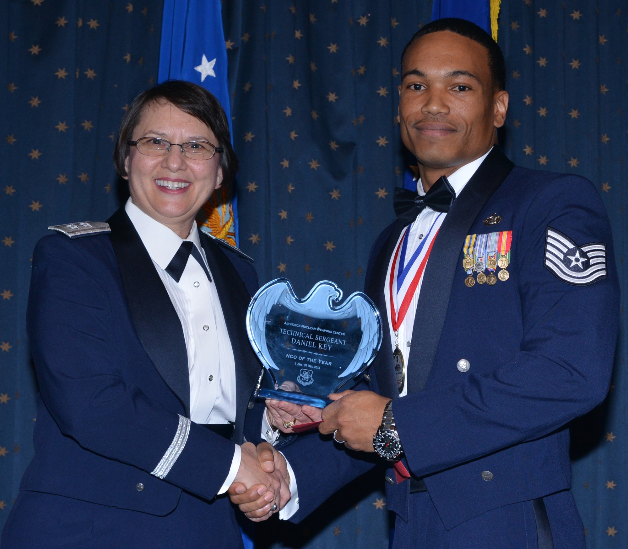 Tech. Sgt. Daniel Key, 377th Security Forces Group, was named AFNWC NCO of the Year at an awards ceremony Feb. 27 at the Mountain View Club. Gen. Sandra Finan, Air Force Nuclear Weapons Center commander, presented the award. (Photo by Todd Berenger)