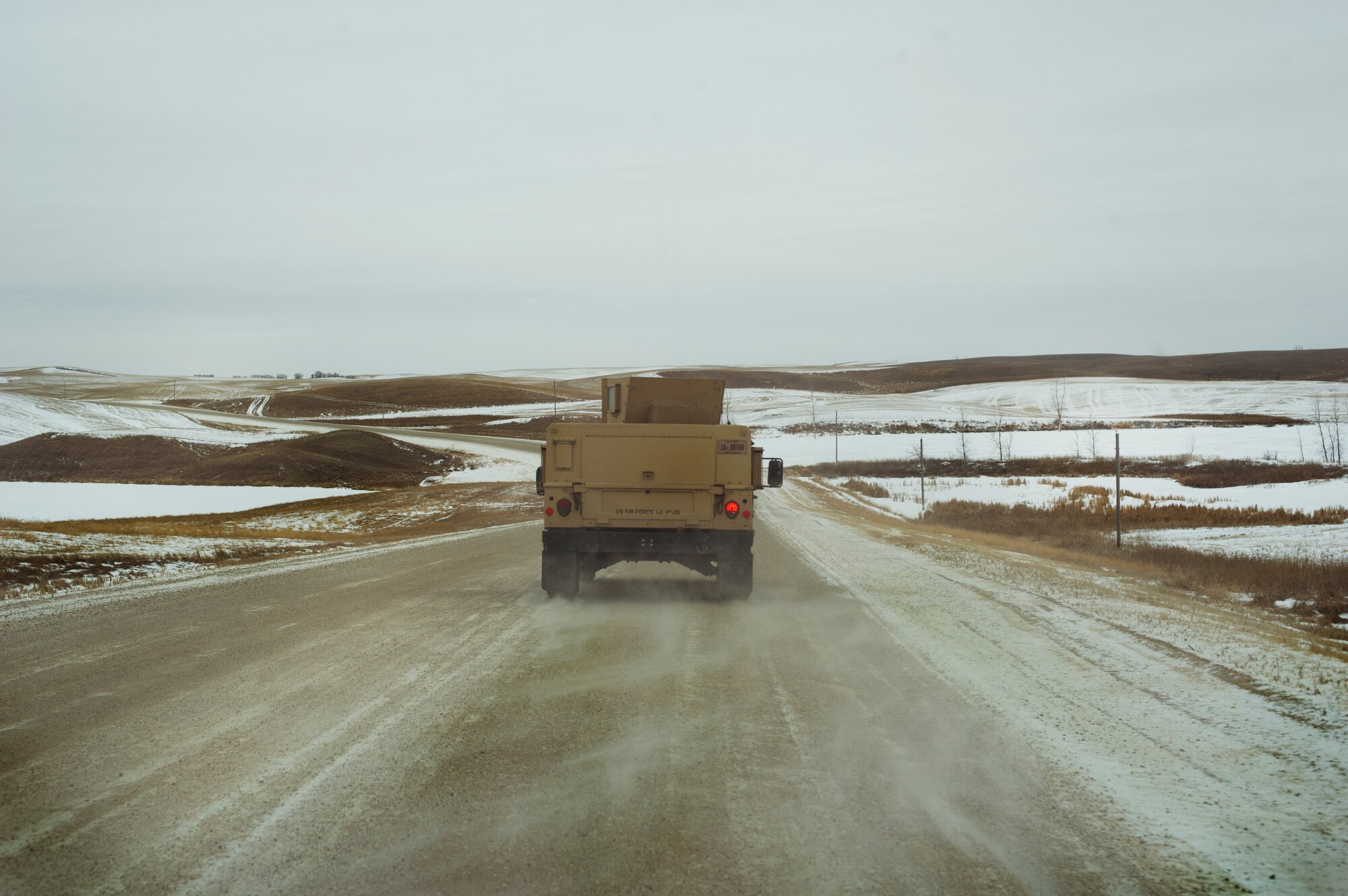 Airmen from the 91st Missile Security Forces “trip-out” to a missile alert facility in North Dakota, Feb. 12, 2015. Security forces have several layers of cold weather gear for warmth. The Humvees they travel in are heated, and they’re able to switch out if necessary so that individuals don’t have to stay in the cold for dangerously long periods of time. (U.S. Air Force photo/Senior Airman Brittany Y. Bateman)