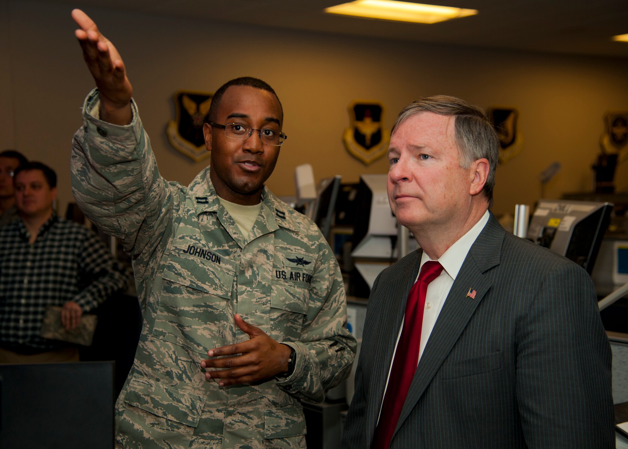 PETERSON AIR FORCE BASE, Colo. – Capt. Freddie Johnson, 561st Network Operations Squadron crew commander, escorts Rep. Doug Lamborn through the squadron’s operations floor Feb. 20. The purpose of the visit was to introduce Lamborn to the Airmen of the 561st NOS and to brief him on the critical mission these men and women execute every day. (U.S. Air Force photo by Staff Sgt. J. Aaron Breeden)