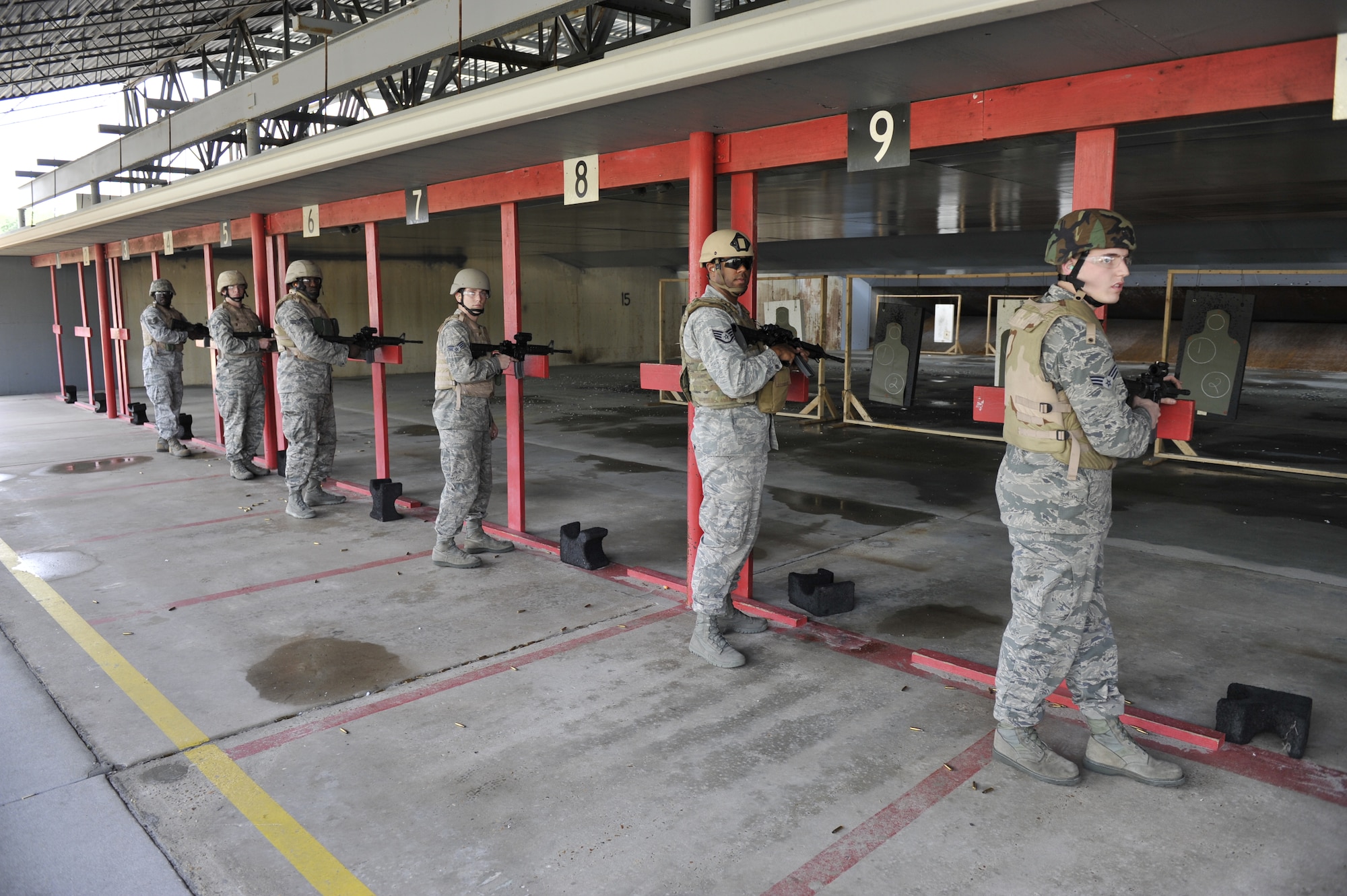 Team Tyndall Airmen get ready to shoot an M4 rifle Feb. 23 at the Combat Arms Training and Maintenance gun range. The 325th Security Forces Squadron CATM unit ensures that Air Force personnel are trained, qualified and certified on the weapon system(s) they are issued or will be issued and maintaining and ensuring all small arms are serviceable. (U.S. Air Force photo by Airman 1st Class Sergio A. Gamboa/Released)