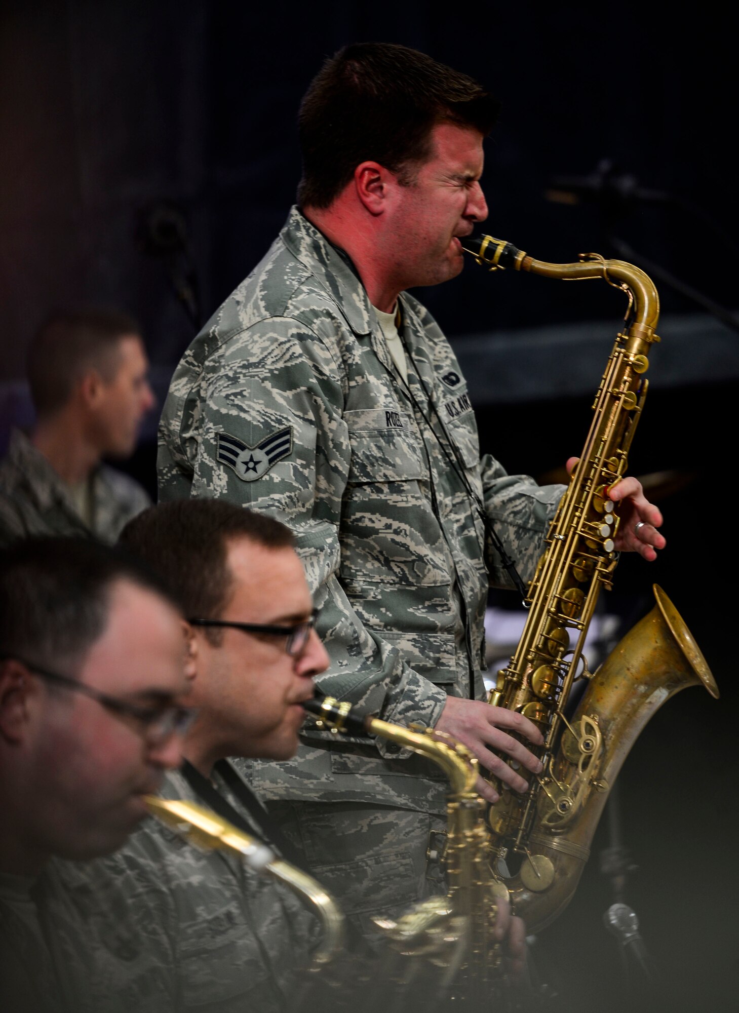 U.S. Air Force Senior Airman Stephen Rozek, U.S. Air Force Heritage of America Band musician, performs alongside the HOAB “Rhythm in Blue” jazz ensemble during a good-will tour for Harry Connick Jr., musician, actor and “American Idol” judge, and his band at Langley Air Force Base, Va., Feb. 23, 2015. After the ensemble’s performance, Connick Jr. and his band played, then shared their experiences as touring musicians. (U.S. Air Force photo by Senior Airman Kayla Newman/Released)