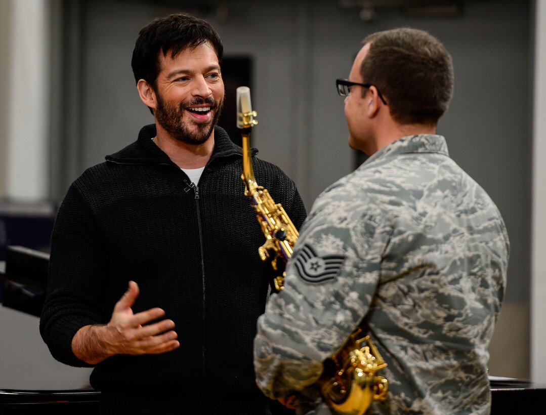 Harry Connick Jr., musician, actor and “American Idol” judge, speaks with U.S. Air Force Tech. Sgt. David Fatek, U.S. Air Force Heritage of America Band musician, after a performance at Langley Air Force Base, Va., Feb. 23, 2015. During the visit hosted by the HOAB “Rhythm in Blue” jazz ensemble, Connick Jr. and his band played for U.S. Air Force, Army and Navy Service member-musicians and shared their experiences as professional musicians. (U.S. Air Force photo by Senior Airman Kayla Newman/Released)