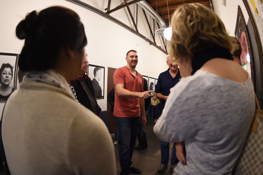 Capt. Ryan Hess, Air Force officer, center, speaks with his family and friends after they watch his performance in the “Bug” for the first time at Jan. 25, 2015, at the Cockroach Theatre in the Las Vegas Art District, Las Vegas. Ryan plays the fictional character Jerry Goss in the play “Bug,” and is cast as the villain who becomes the voice of reason. (U.S. Air Force photo by Tech. Sgt. Nadine Barclay)