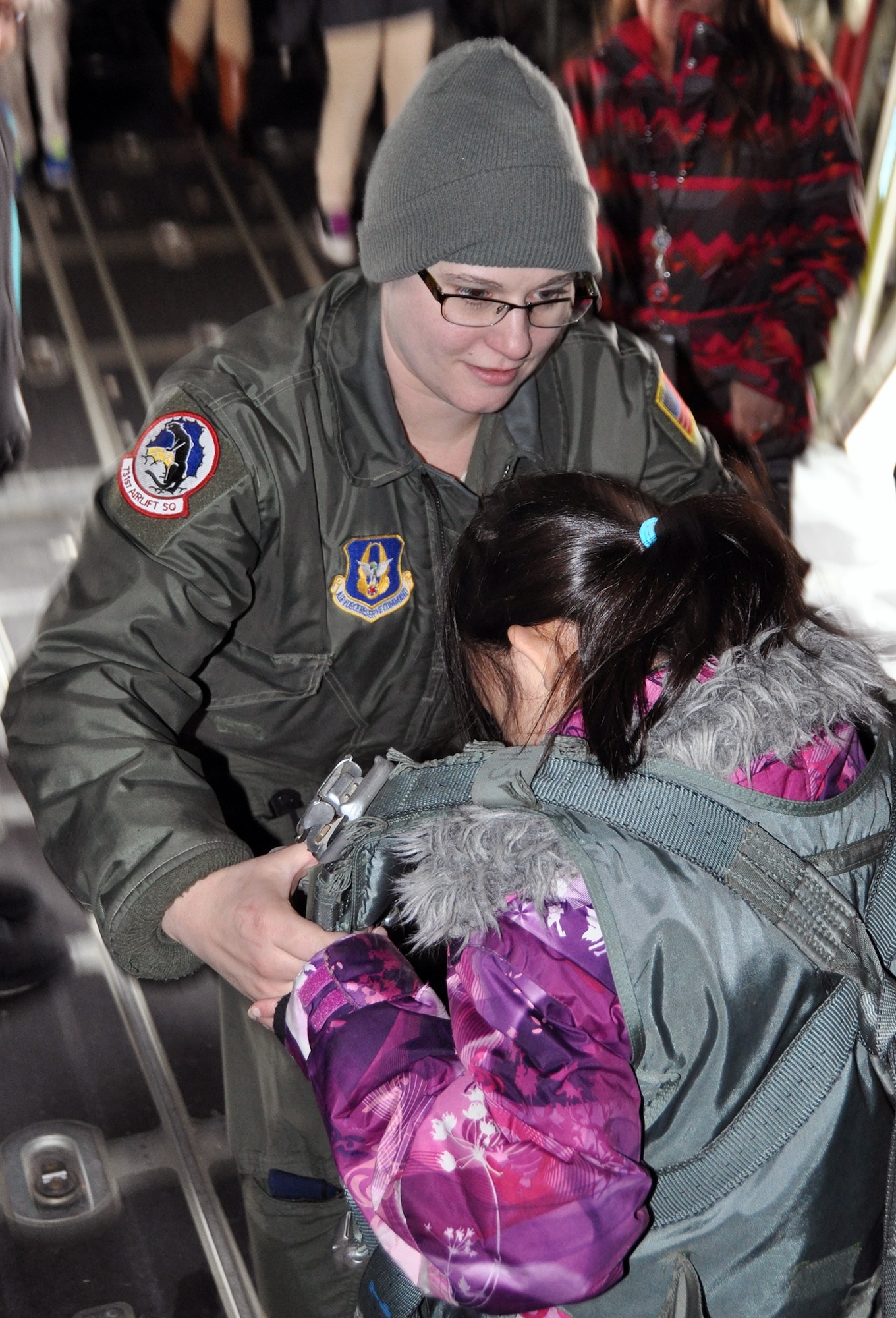 PETERSON AIR FORCE BASE, Colo. – Senior Airman Tracie Bontempo, a C-130 loadmaster with the Air Force Reserve Command’s 302nd Airlift Wing, explains how a flight harness works during a tour with Peterson AFB STARBASE students Feb. 25, 2015 here. More than 20 students spent the afternoon with 302nd AW Airmen to learn about their missions and to tour a C-130 aircraft. According to their official website, “STARBASE students participate in challenging ‘hands-on, mind-on’ activities in Science, Technology, Engineering, and Math. They interact with military personnel to explore careers and observe STEM applications in the real world. The program provides students with 25 hours of experiences at bases across the nation.” (U.S. Air Force photo/Master Sgt. Daniel Butterfield) 