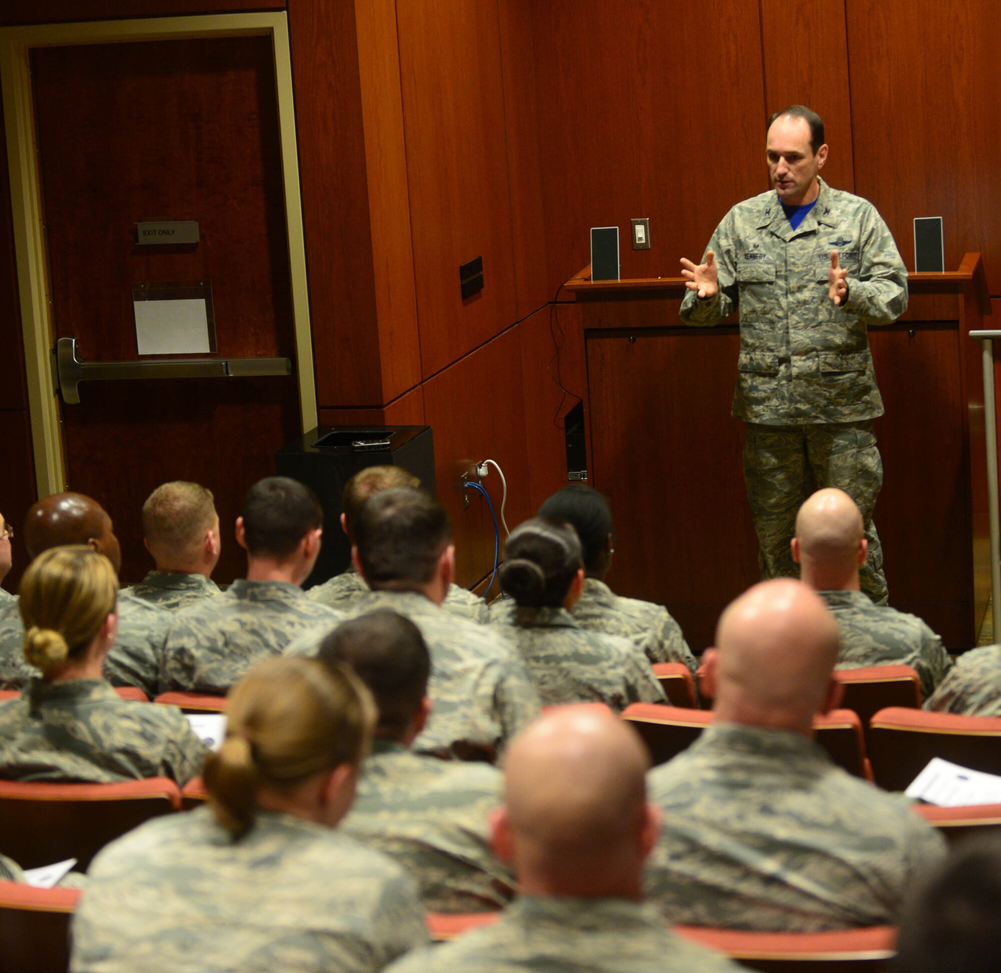 Col. Kevin Kennedy, 28th Bomb Wing commander, discusses the importance and value of first sergeants to a group of 30 junior and senior NCOs interested in becoming a first sergeant during a symposium at Ellsworth Air Force Base, S.D., Feb. 20, 2015. The seminar was designed to train and educate NCOs on daily duties and responsibilities of being a first sergeant which enhances their ability to lead Airmen and take care of issues that affect readiness and mission effectiveness. (U.S. Air Force photo by Airman 1st Class Zachary Hada/Released)