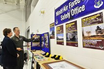 Lt. Col. Jared Nelson, Minot Air Force Base missile wing safety chief, talks to Carol Thurn, Co-Manager of the Traffic Safety Office for North Dakota Department of Transportation, at the McKenzie County Traffic Safety Day in Watford City, N.D., Feb. 24, 2015. Nelson attended the event to spread awareness about driving around military vehicles.  The base’s leadership has been meeting with city officials from communities within the missile complex to gain awareness on potential hazards and find solutions to help mitigate vehicle accidents. Since 2003, traffic fatalities have increased by more than 60% in North Dakota oil-drilling counties, many of which are shared with the missile complex. (U.S. Air Force photo/SrA Brittany Y. Bateman)