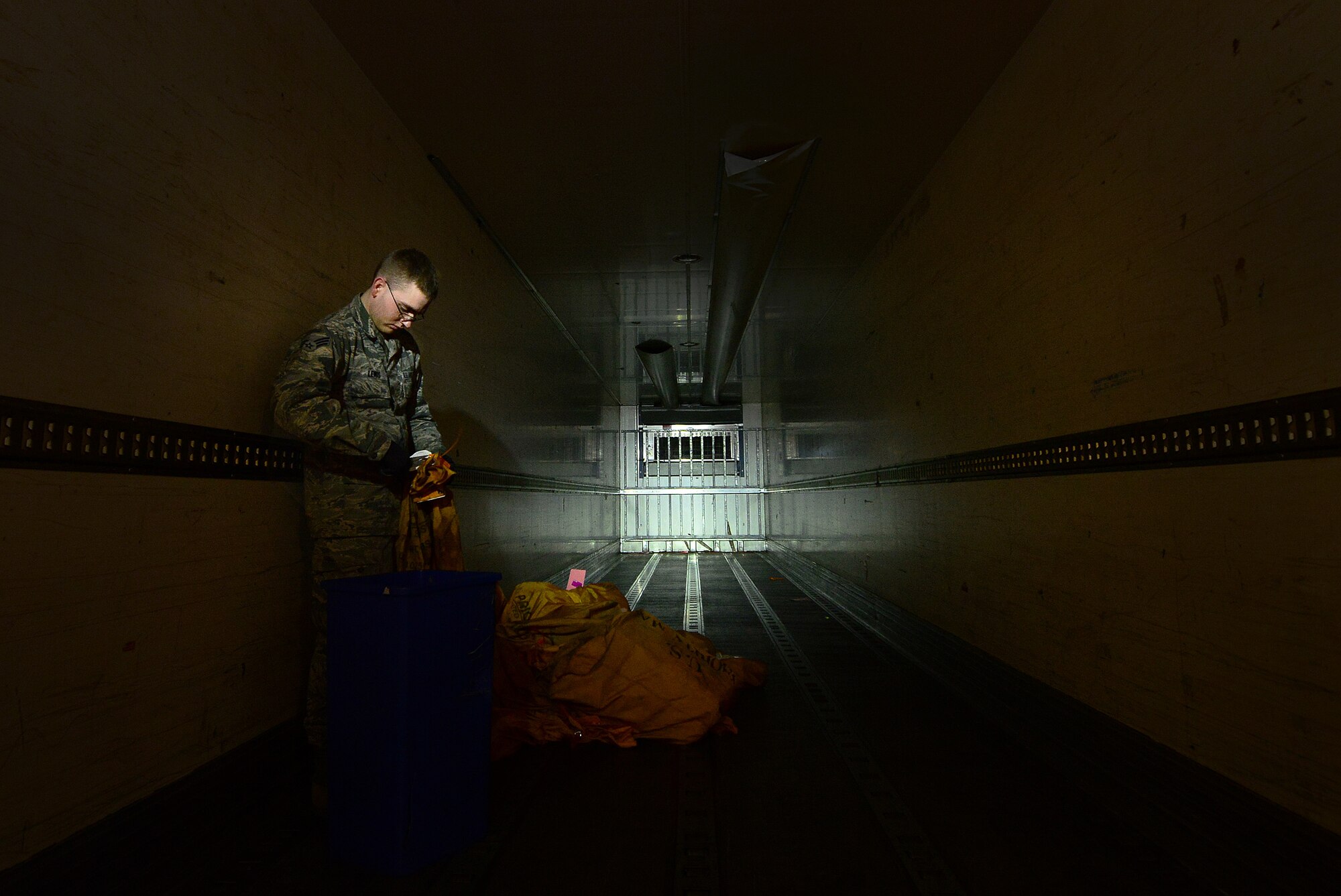 U.S. Air Force Senior Airman James Lewis, 31st Communication Squadron post office clerk, unloads a delivery truck at the post office, Feb. 24, 2015, at Aviano Air Base, Italy. Before mail is unloaded, sorted, tagged and shelved, it travels through locations such as New York, England and Germany. (U.S. Air Force photo by Senior Airman Matthew Lotz/Released)