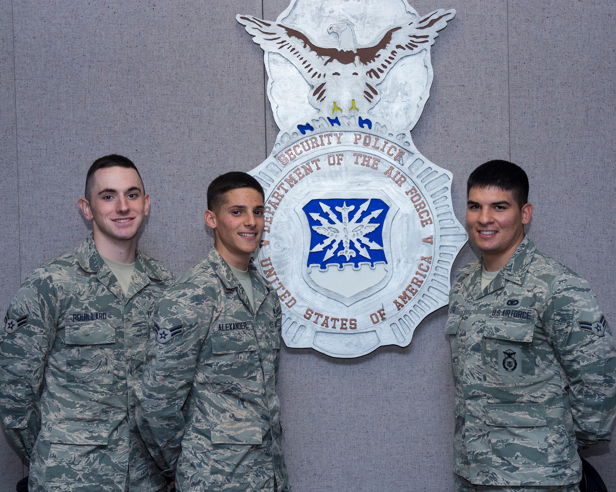 Airman 1st Class Tyler Rouillard, Tyler Alexander and Ricardo Lugo graduate from the 343rd Training Squadron Combat Arms Instructor Apprentice Course, Feb. 24, at Joint Base San Antonio-Lackland. The Airmen graduated from the Security Forces Apprentice Course in December 2014 and directly enrolled into the CAI course in January. Typically, SF Airmen must complete certain prerequisites, such as promotion to senior airman or staff sergeant, before being retrained into the CAI career field. These Airmen were hand picked out of about 200 volunteer applicants; they had the highest test score, zero derogatory comments, high progress checks, were recommended by their flight chief and instructors, and stood out in a series of three interviews. (U.S. Air Force photo by Airman 1st Class Justine Rho)