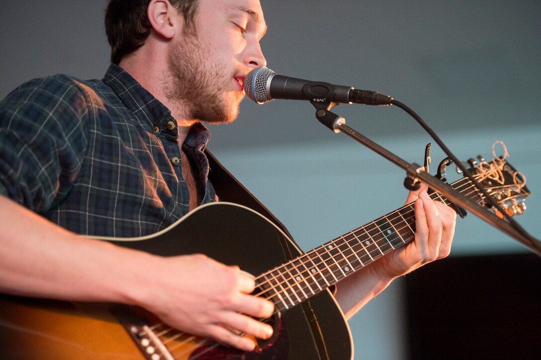 Phillip Phillips sings and plays guitar at a USO show on Ramstein Air Base in Germany, March 3, 2015. 