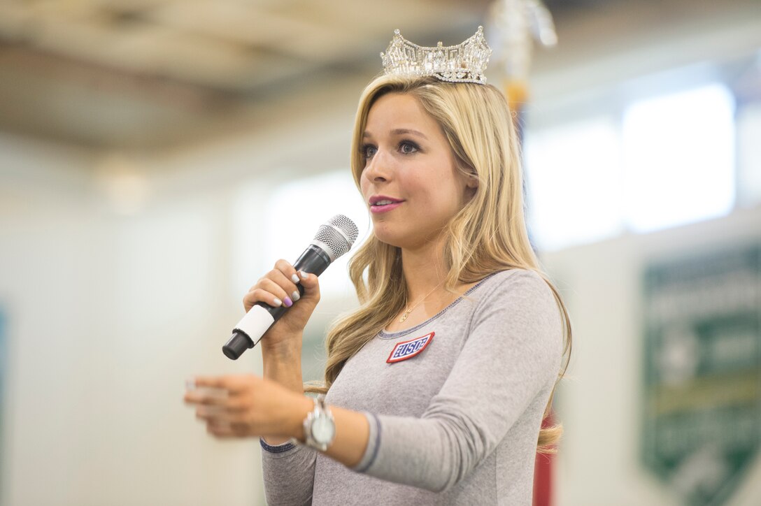 Miss America Kira Kazantsev speaks to the audience during the USO tour in Naples, Italy, March 3, 2015. 