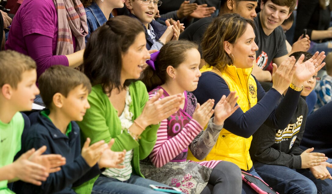 The audience applauds during the USO tour in Naples, Italy, March 3, 2015. 