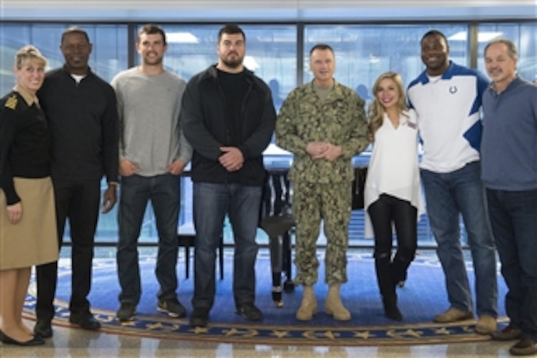 Navy Adm. James A. Winnefeld Jr., vice chairman of the Joint Chiefs of Staff, center, poses with USO tour participants after visiting wounded warriors at the Walter Reed National Military Medical Center in Bethesda, Md., March 2, 2015. From left: actor Dennis Haysbert; Indianapolis Colts quarterback Andrew Luck; Pittsburgh Steelers guard David DeCastro; Winnefeld; Miss America Kira Kazantsev; Colts tight end Dwayne Allen; and Colts head coach Chuck Pagano.